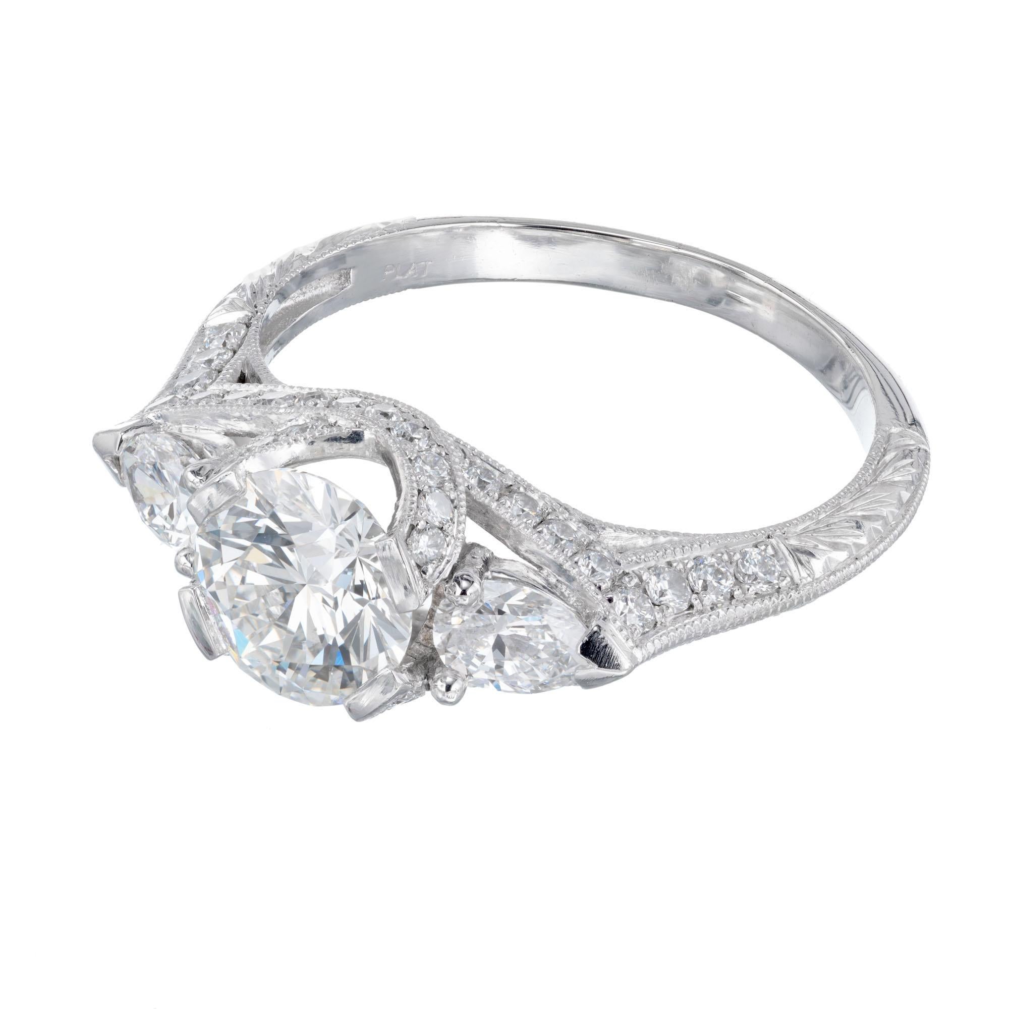 Peter Suchy diamond engagement ring. GIA certified round center stone with 2 pair shaped side diamonds and 50 round accent diamonds, in a platinum setting crafted in the Peter Suchy Workshop.  

1 round diamond, approx. total weight 1.05cts, G, SI1,