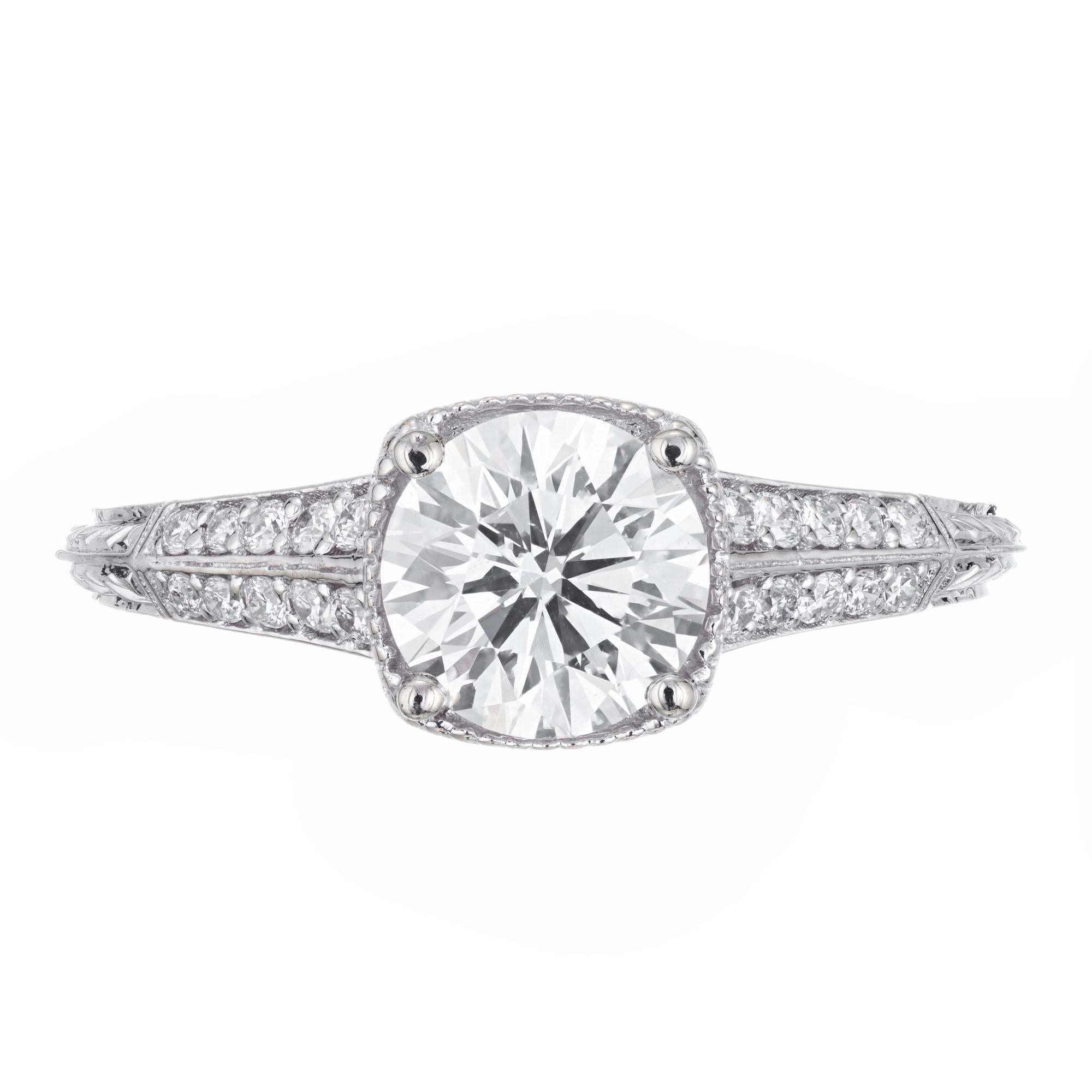 Ideal Brilliant cut diamond engagement ring. GIA certified center stone, set in a 18k white gold setting with 20 round accent diamonds. 

1 round diamond, approx. total weight 1.10cts, G, SI1, GIA certificate #2175779159
20 round diamonds, approx.