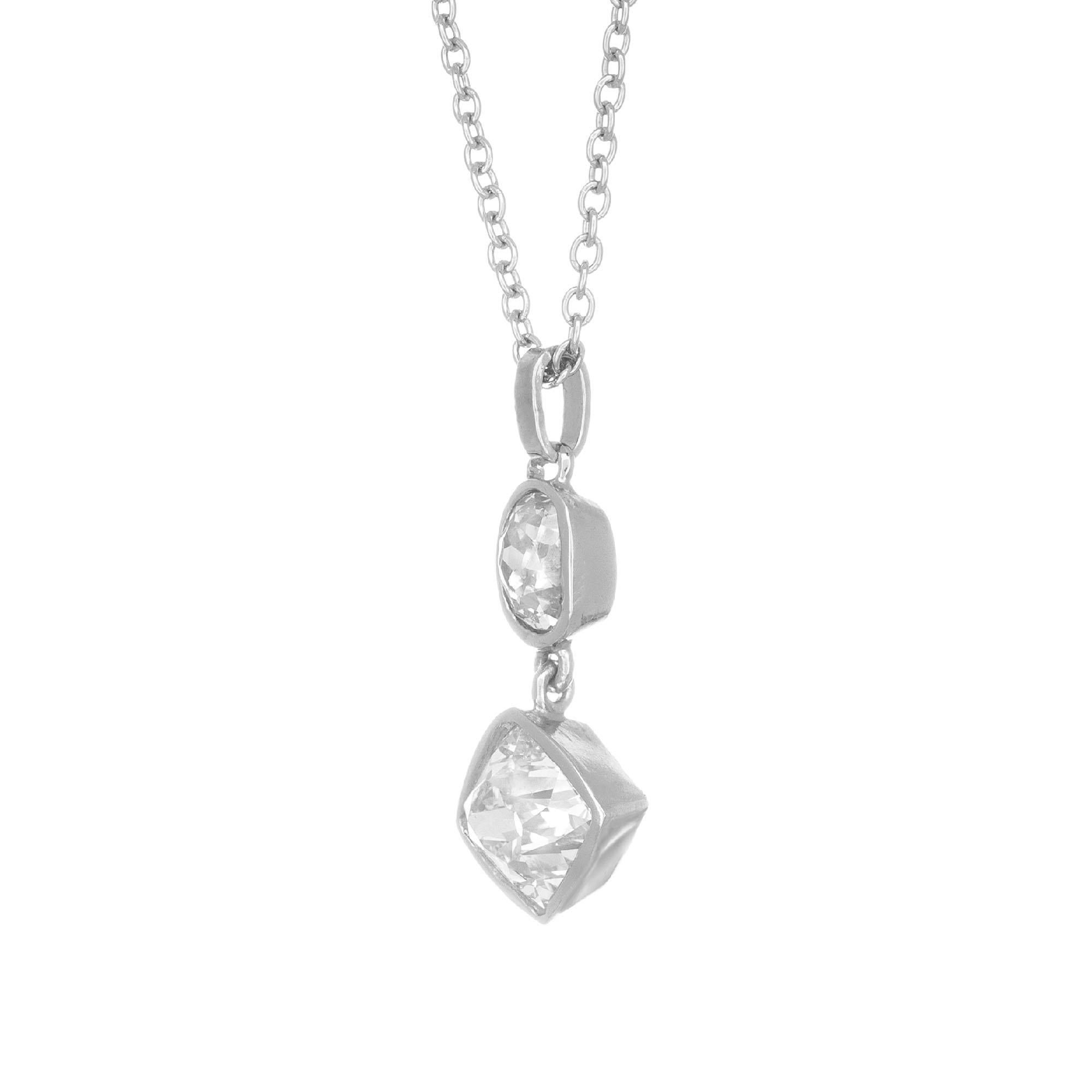 Old mine oval and square cushion cut diamonds made into a classic dangle pendant, set in platinum. Crafted in the Peter Suchy workshop.

1 cushion brilliant cut diamond G SI2, approx. .80cts GIA Certificate # 5181649369
1 oval cushion diamond I I,