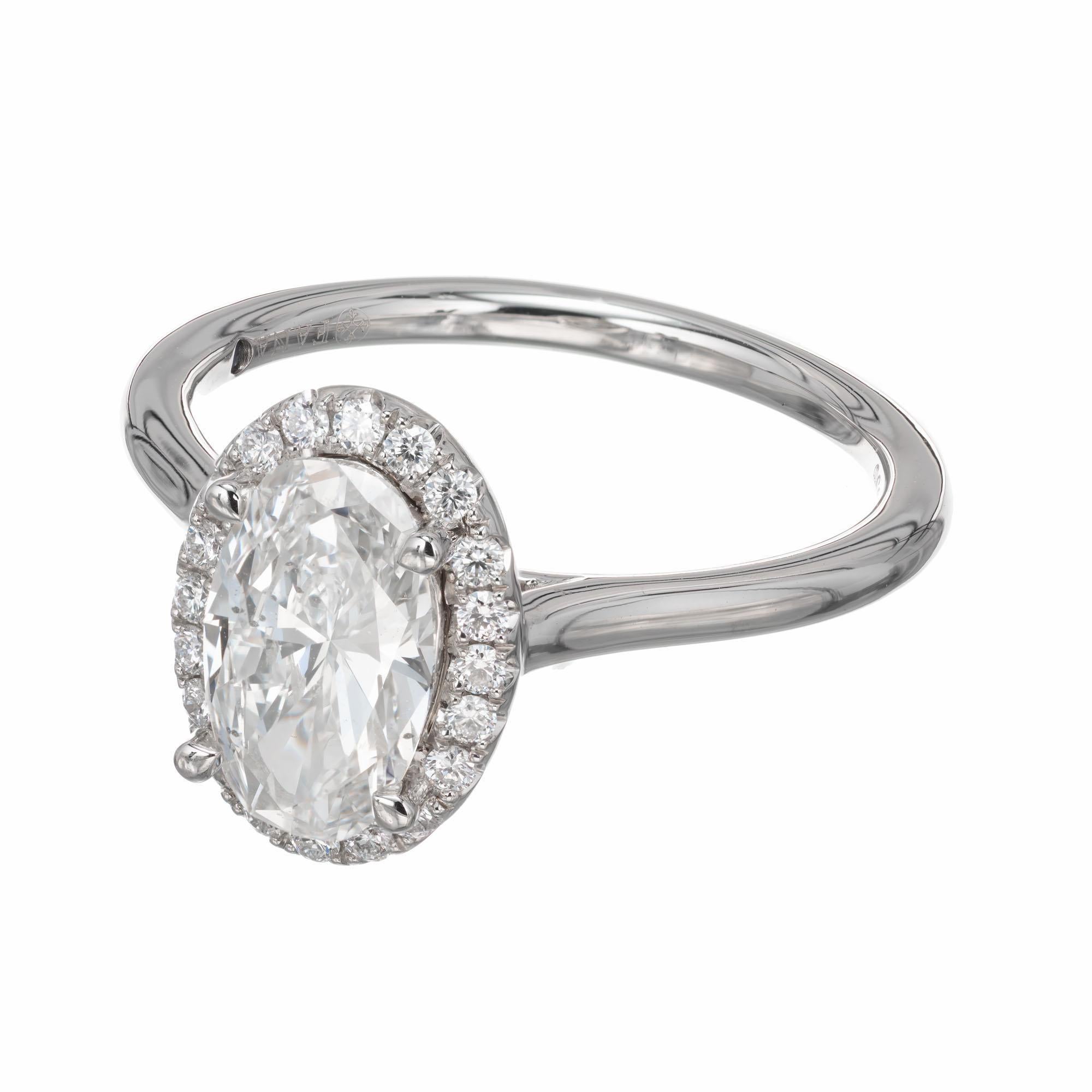 Peter Suchy oval halo diamond engagement ring. GIA certified oval center stone set in platinum with a halo of round diamonds. Crafted in the Peter Suchy Workshop.  

1 oval cut diamond I SI, approx. 1.17cts.  GIA Cert# 5202332987
22 round brilliant