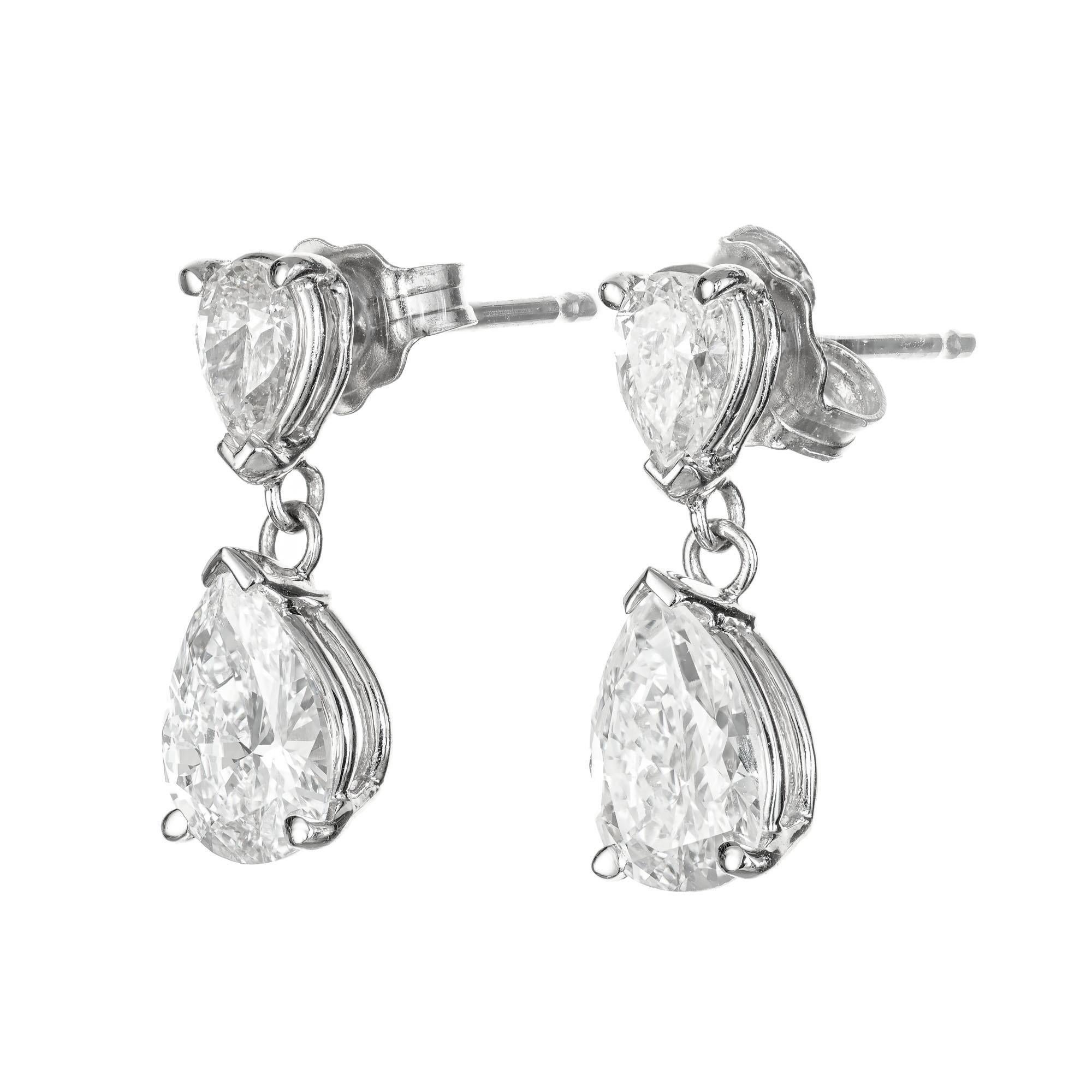 1960's pear shaped diamond dangle earrings. 2 GIA certified pear shaped dangles with 2 pear shaped tops in a platinum settings. Designed and crafted in the Peter Suchy workshop.

1 pear shape diamond, D SI approx. .57cts GIA certificate #