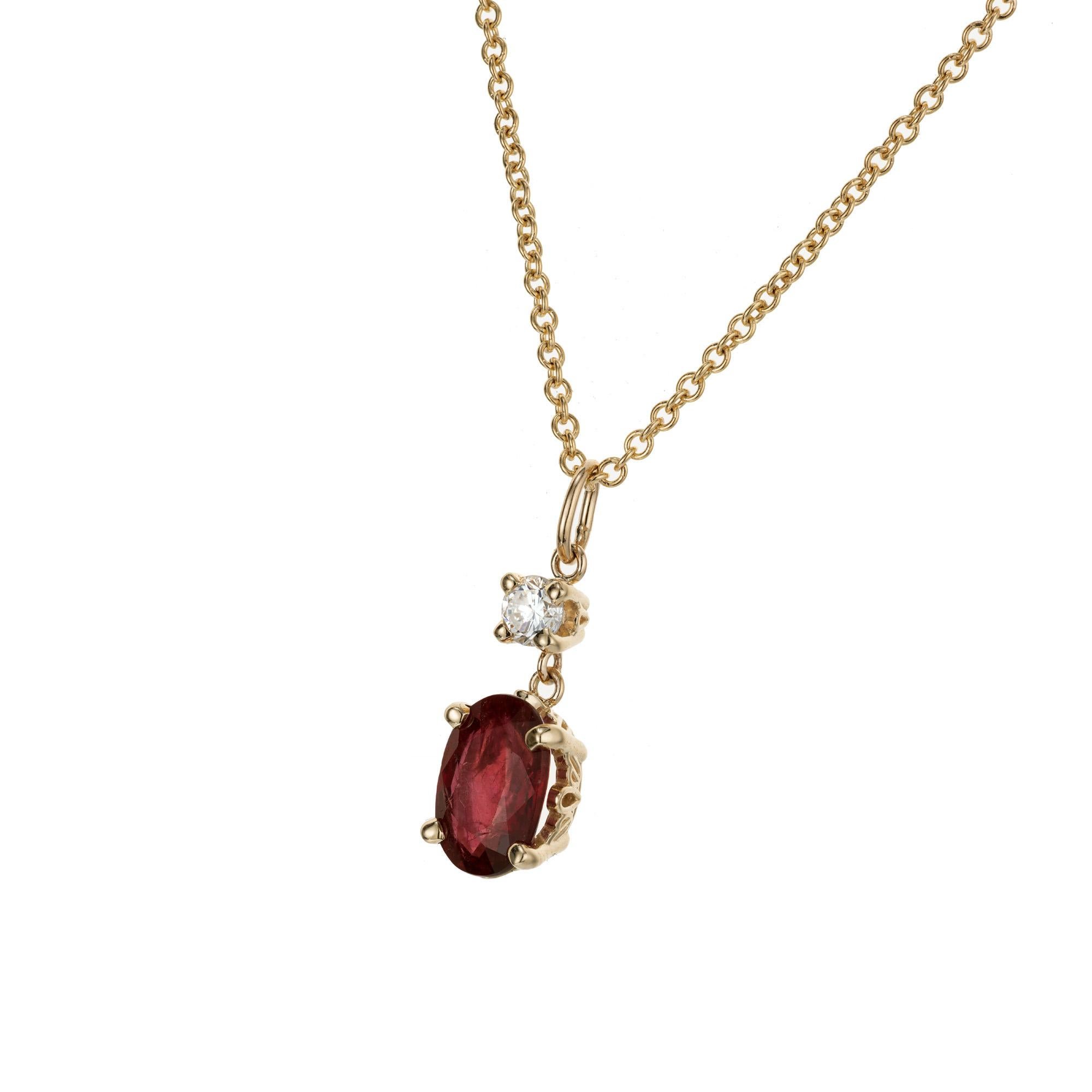 Oval ruby diamond pendant necklace. GIA certified natural simple heat only oval ruby set in a scroll basket 14k yellow gold setting, with one round full cut accent diamond. 16 inch 14k yellow gold chain.  Designed and crafted in the Peter Suchy