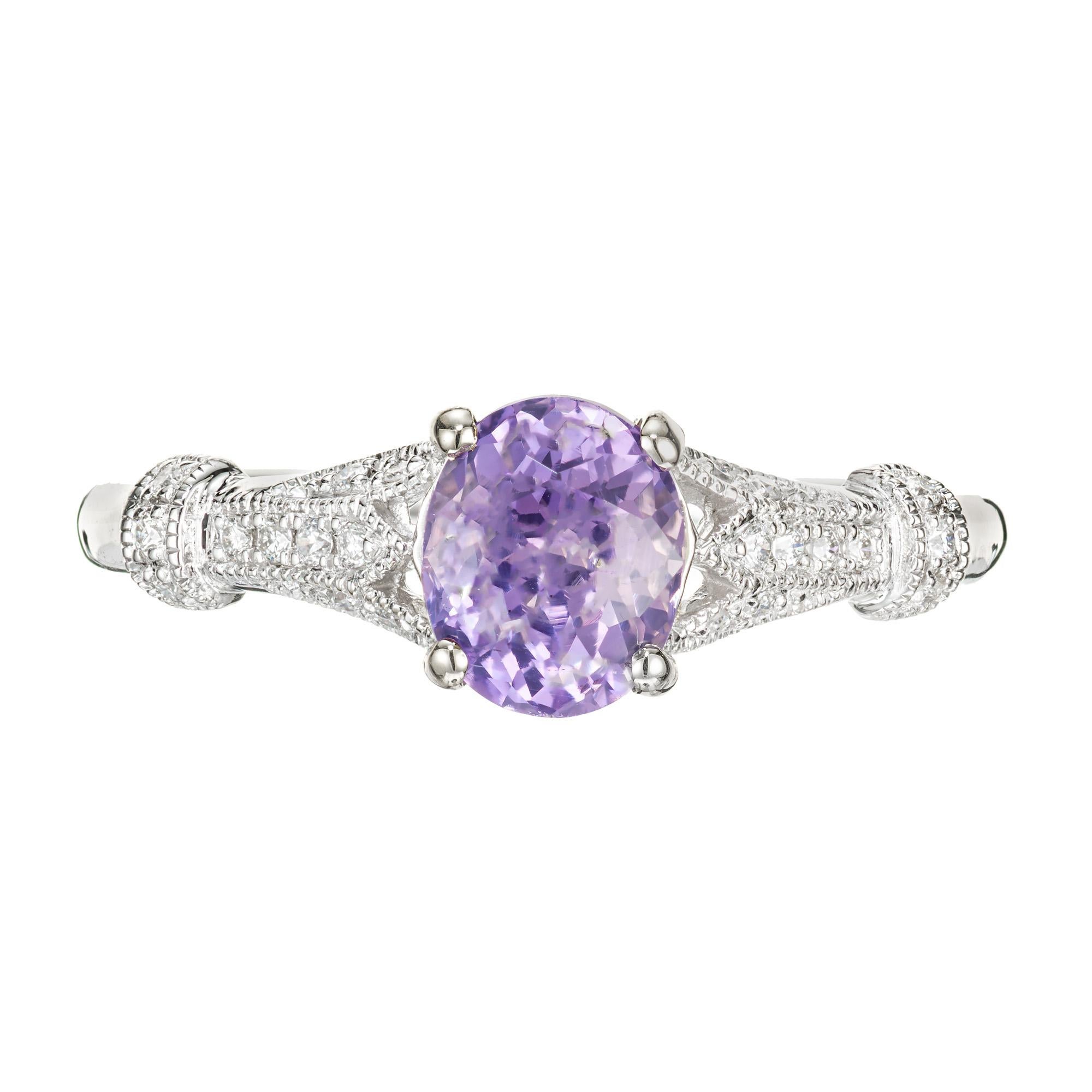 Purple and pink sapphire and diamond engagement ring. GIA certified 1.24cts oval center sapphire, 18k white gold antique inspired setting with 22 round accent diamonds. GIA certified natural. Designed and crafted in the Peter Suchy workshop.

1 oval