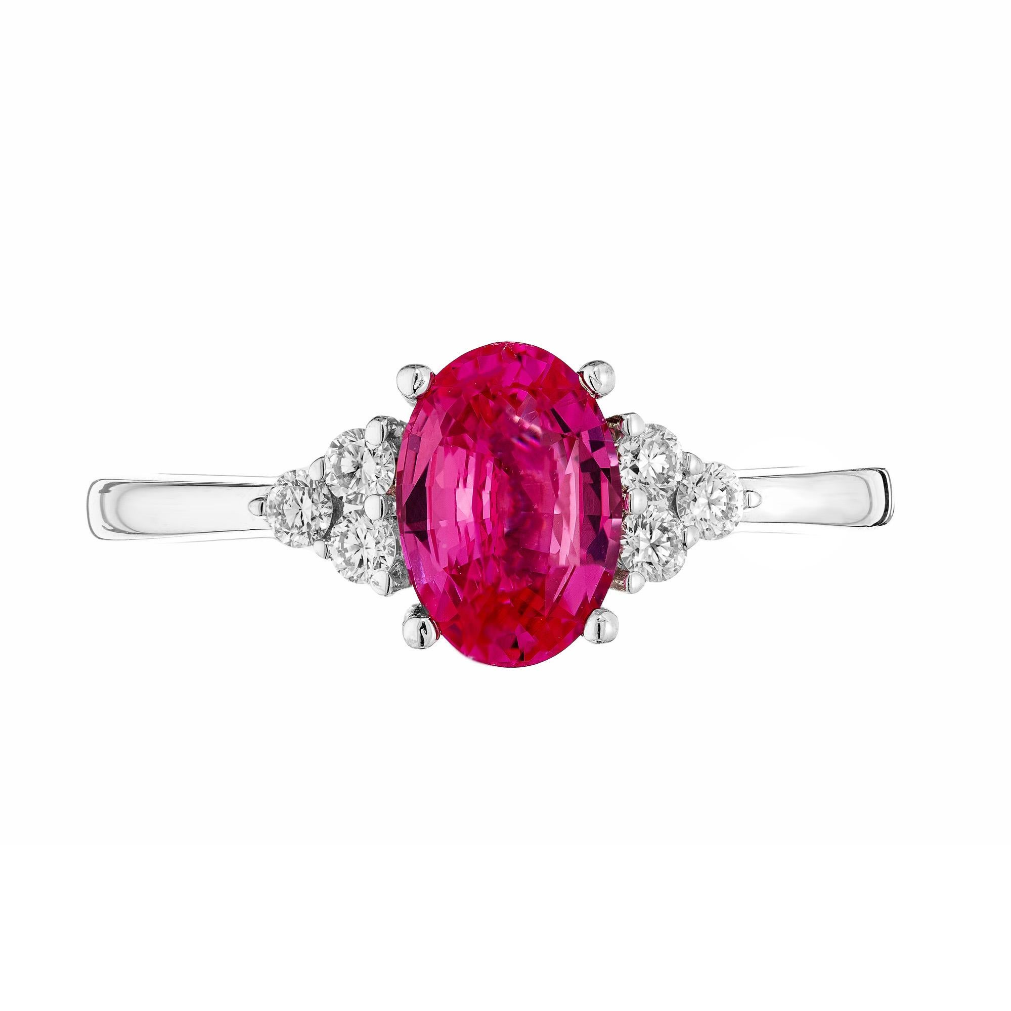 This is a beautiful 1.25 carat GIA certified pink sapphire in a custom 18k white gold setting accented by natural white round brilliant diamonds. A timeless piece of jewelry. Perfect for those who appreciate luxury and uniqueness, this ring is a