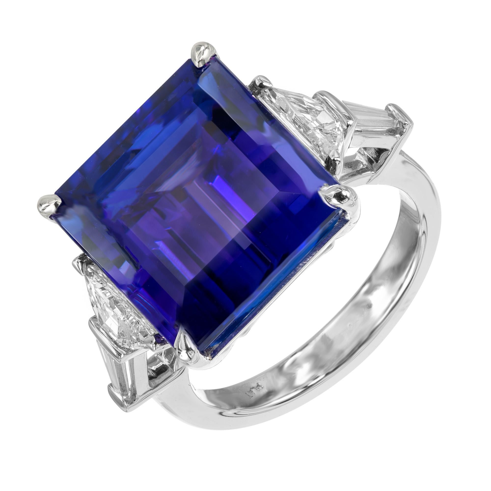 Experience the breathtaking allure of the Peter Suchy GIA certified 13.00 Carat octagonal Tanzanite and Diamond Platinum engagement ring. This ring is a masterpiece, where the vibrant blue-violet hue of the octagonal tanzanite stone is perfectly