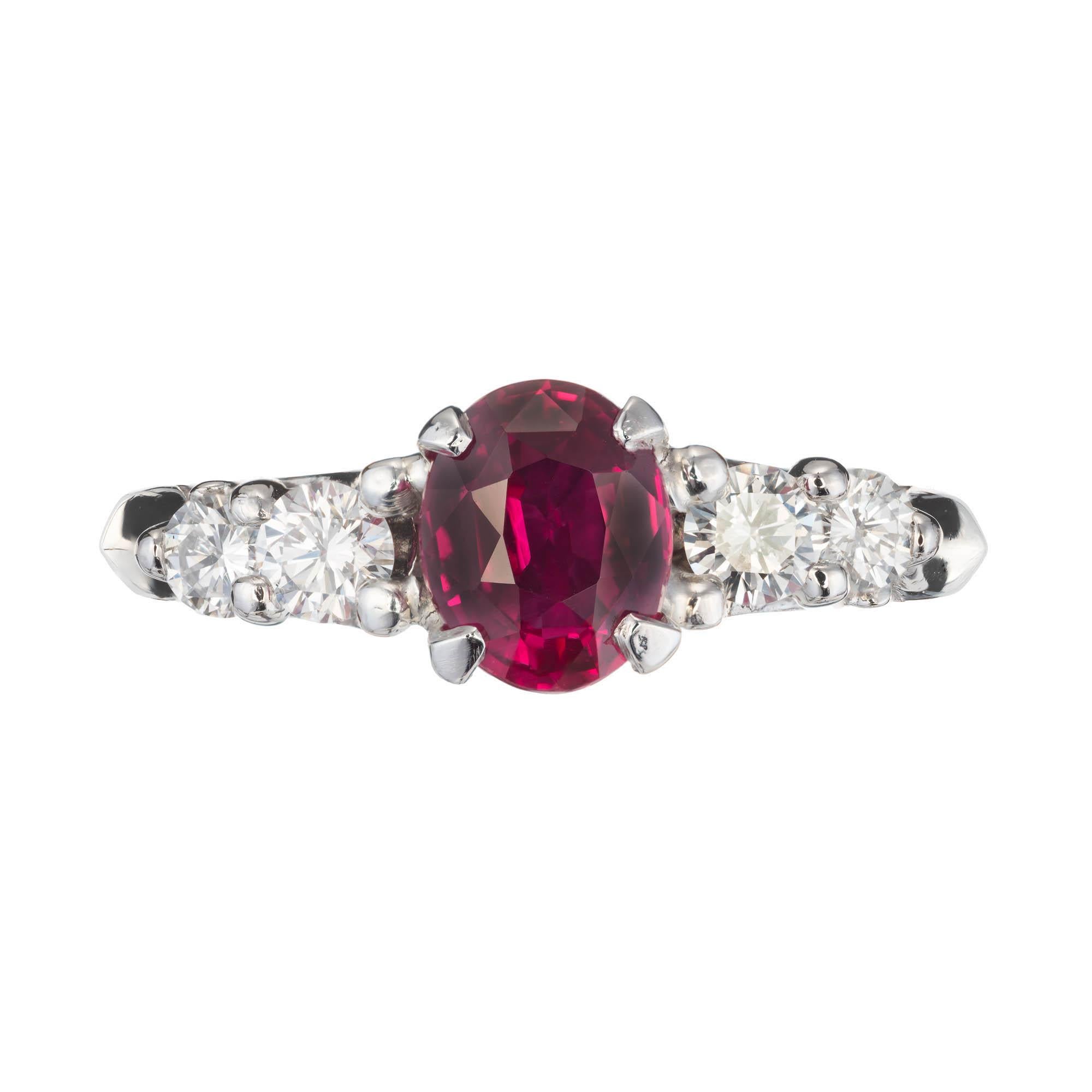 Peter Suchy ruby and diamond engagement ring. GIA certified natural ruby center stone, with two round accent diamonds on each side of the platinum setting. Hand crafted in the Peter Suchy Workshop. 

1 oval red ruby, Approximate 1.35 carats. GIA