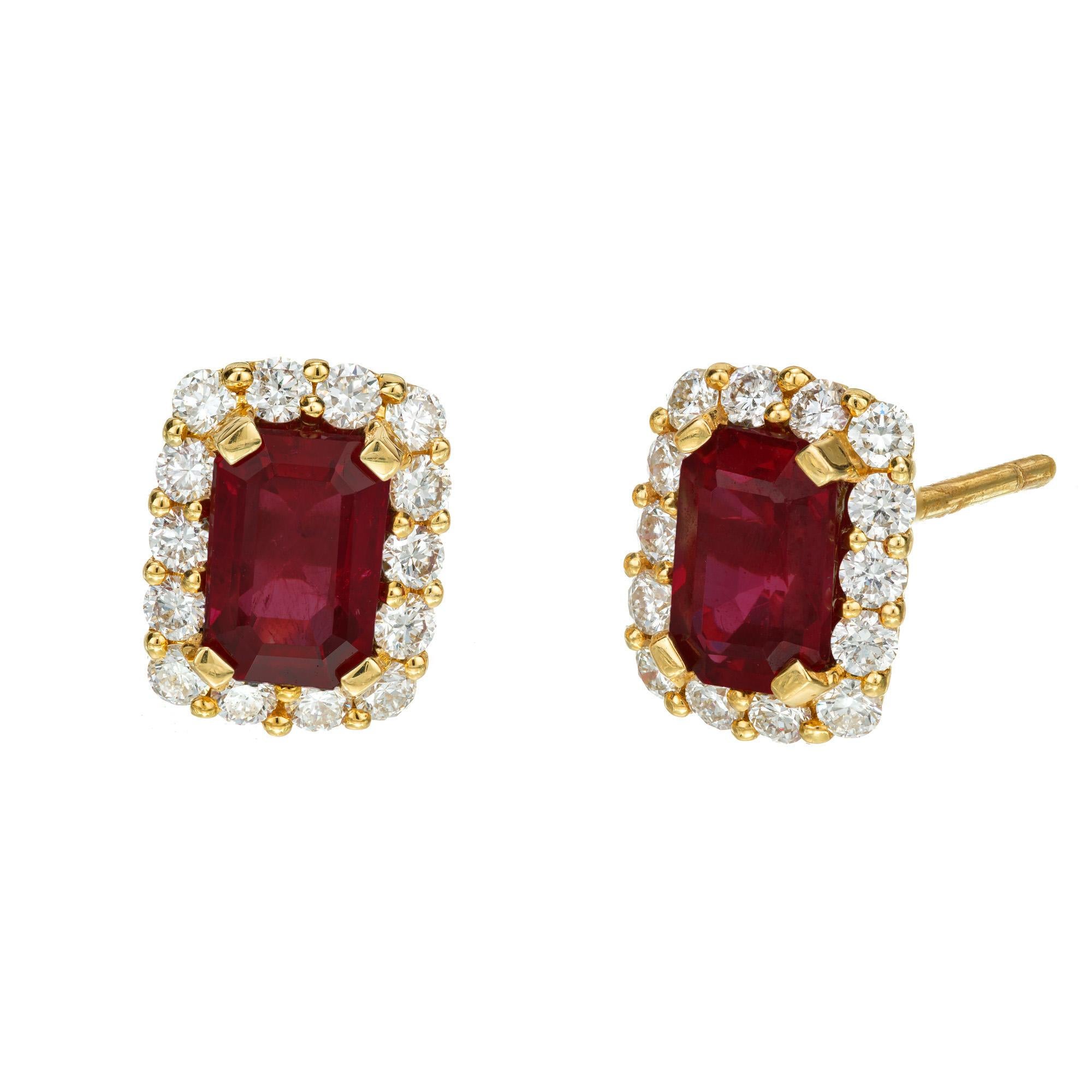 Classic red ruby diamond earrings. 2 octagonal red rubies, each with a halo of round brilliant cut diamonds in 14k yellow gold settings. Designed and crafted in the Peter Suchy workshop

2 octagonal red rubies, approx. 1.44cts GIA certificate #