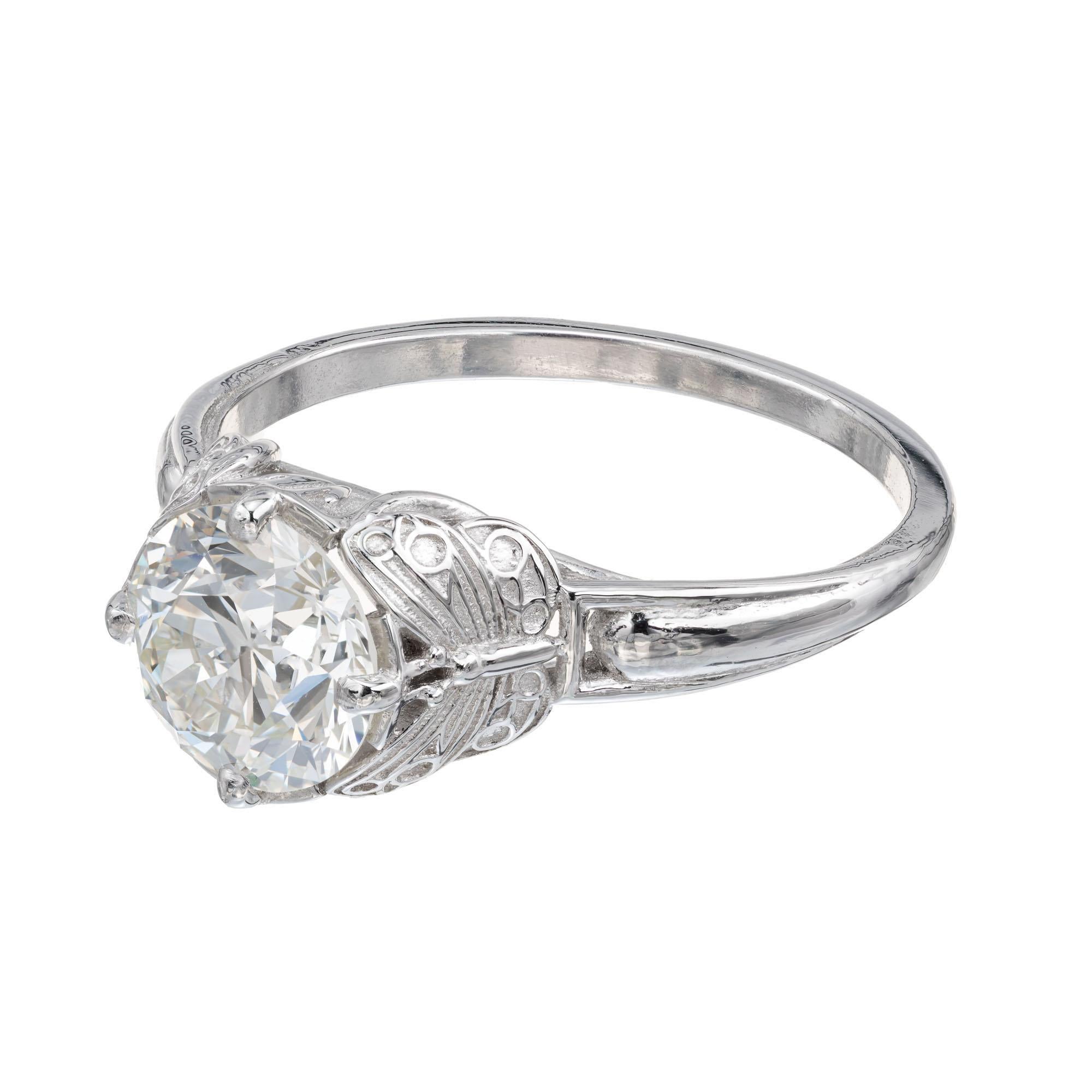 European Brilliant cut diamond engagement ring. GIA Certified certified 1.45ct center stone in a platinum butterfly style setting. The ring is designed and crafted in the Peter Suchy Workshop. 

1 European brilliant cut diamond I VS, approx. 1.45cts