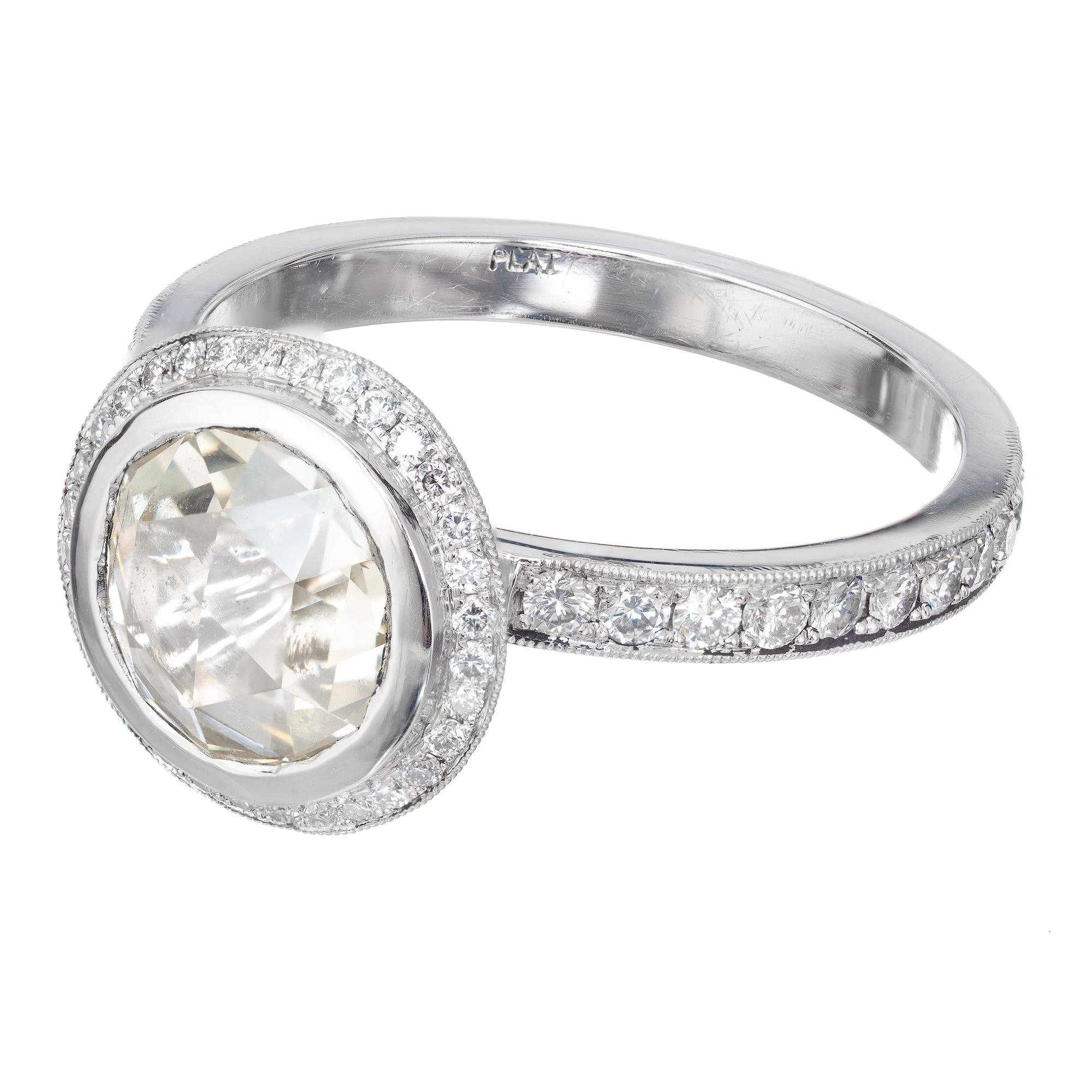 Original rose cut 1.46ct diamond halo engagement ring. The center stone is GIA certified with a warm soft light-yellow tint, surrounded by a halo of round diamonds in a platinum setting created in the Peter Suchy Workshop. Made to fit a wedding band