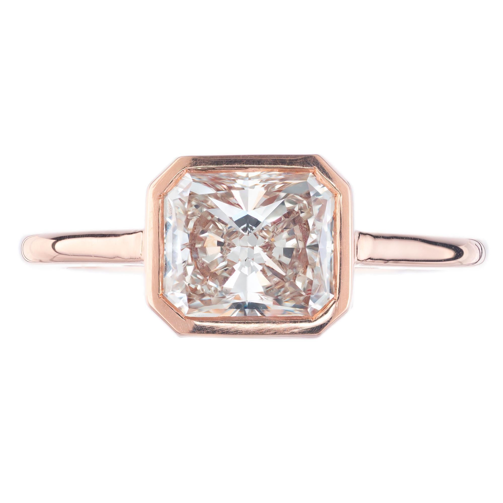 GIA certifed cut-cornered rectangular modified brilliant cut diamond engagement ring in a 14k rose gold solitaire setting, crafted in the Peter Suchy Workshop. Alternative design to fit flush with a wedding band. 

1 cut cornered rectangular