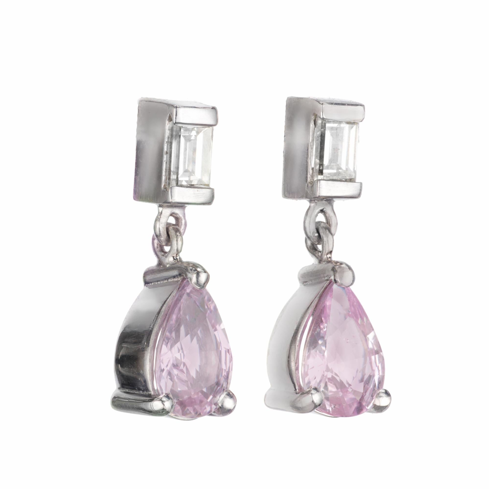 Pink sapphire and diamond dangle earrings. Soft pink pear shape sapphires from an 1940's estate. Set in classic platinum setting with two baguette accent diamonds. Picked at random tested as natural no heat by the GIA. 

2 pear shaped very light