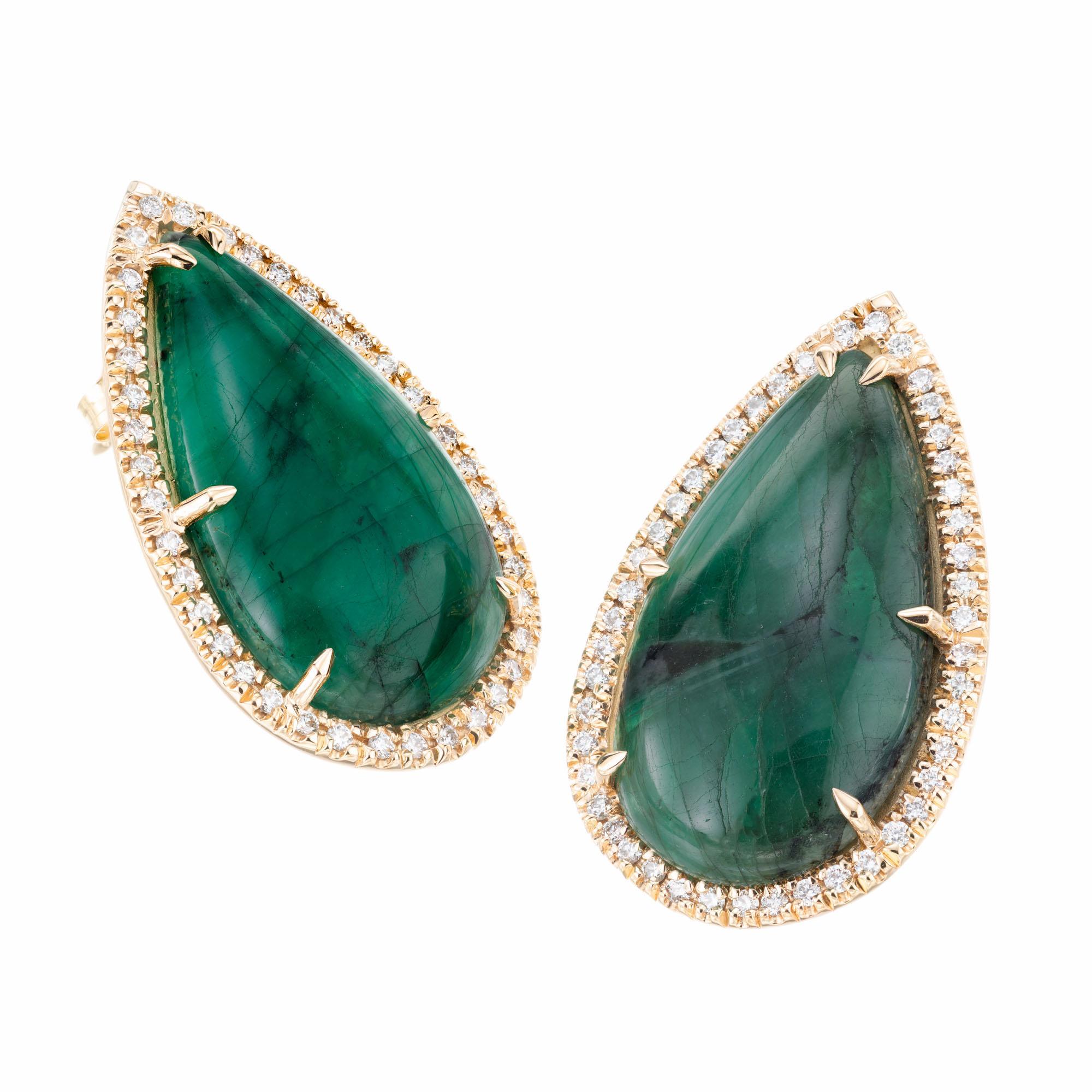 Pear shape cabochon 15.53 carat emerald diamond earrings. GIA certified natural untreated emeralds with 85 round brilliant cut diamond halos. Created in the in the Peter Suchy workshop.

2 pear shaped green cabochon emeralds, approx. 15.53cts GIA