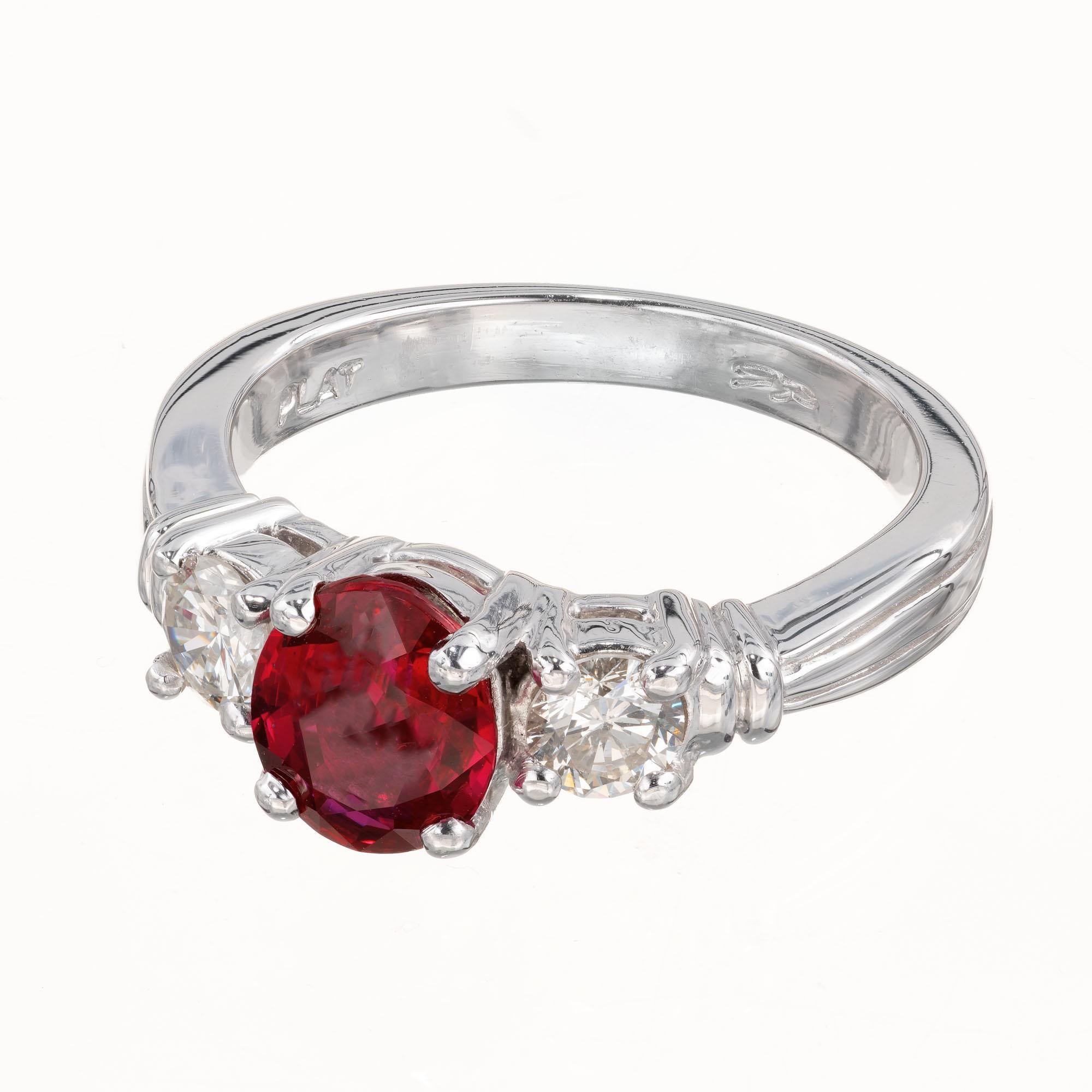GIA certified no heat no enhancements ruby and diamond enagement ring. Oval ruby center stone with 2 round side diamonds set in a platinum, classic three stone setting. Created in the Peter Suchy Workshop.  

1 oval bright red ruby SI, approx.