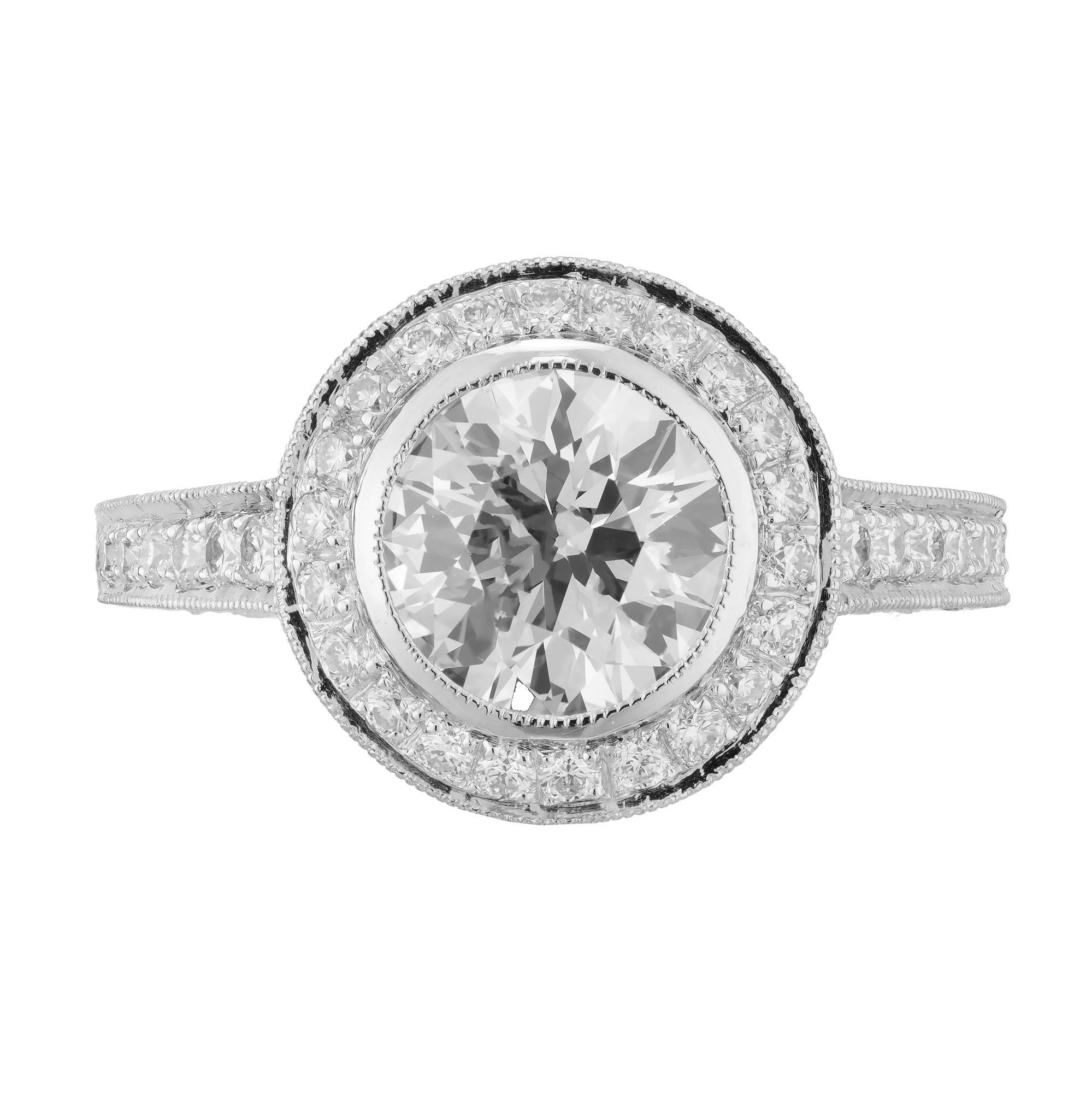 European transitional Ideal cut diamond engagement ring. GIA certified 1.61cts round center stone in a platinum halo setting with 114 round micro pave set accent diamonds. Raised crown and small table. Created in the Peter Suchy Workshop. 

1 round