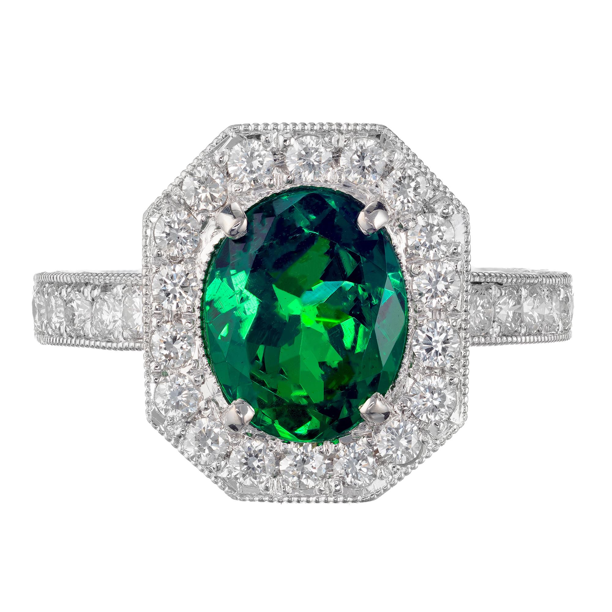 Vivid green tsavorite garnet and diamond engagement ring.  GIA certified 1.85 carat tsavorite garnet center stone in a platinum hand engraved, pave diamond setting, designed and crafted in the Peter Suchy Workshop. 

1 oval green tsavorite garnet,