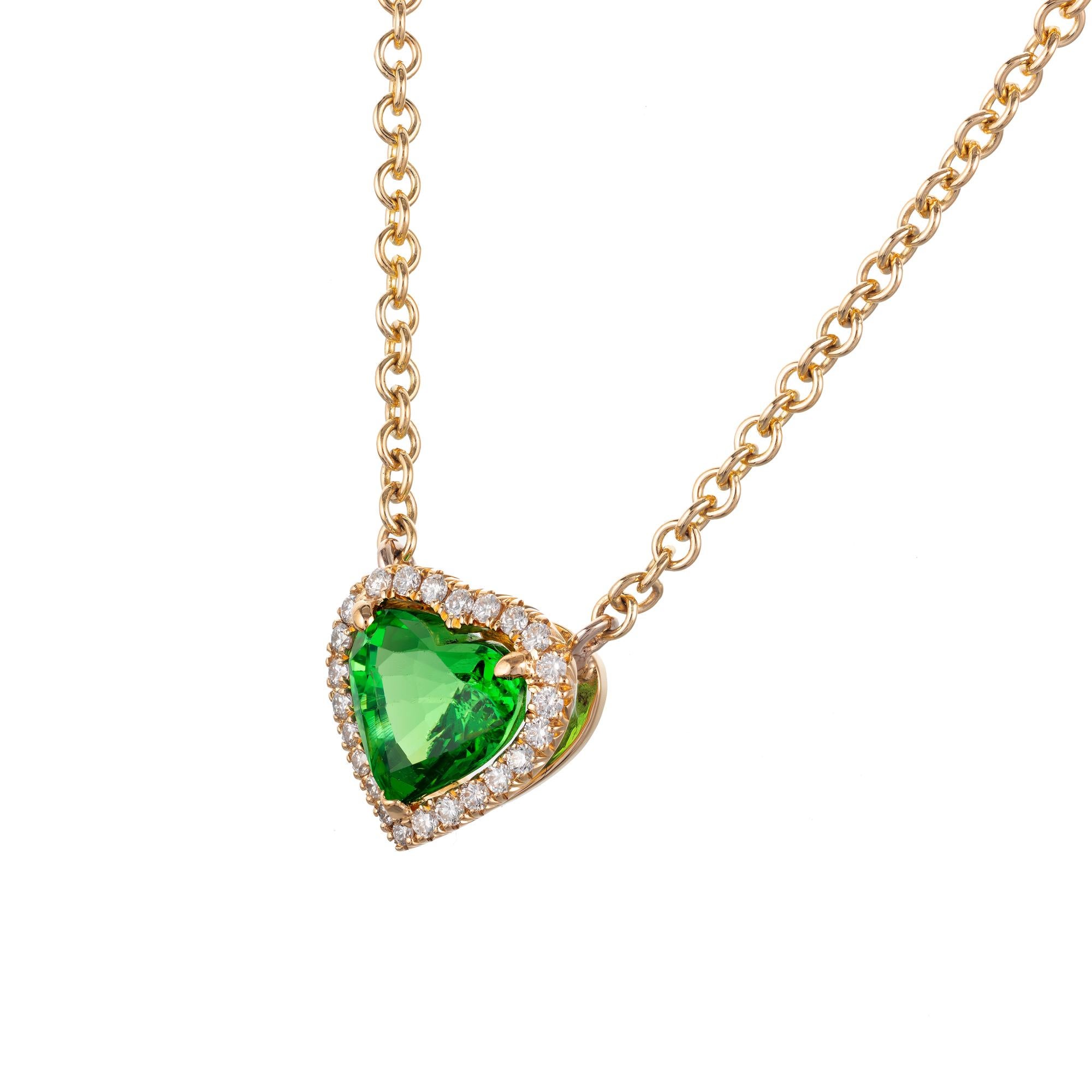 Tsavoraite green garnet heart shaped and diamond halo pendant necklace in 18k yellow gold.  The pendant was made in the Peter Suchy workshop. GIA certified. 

1 heart shaped green SI tsavorite garnet, Approximate 1.88cts GIA Certificate #