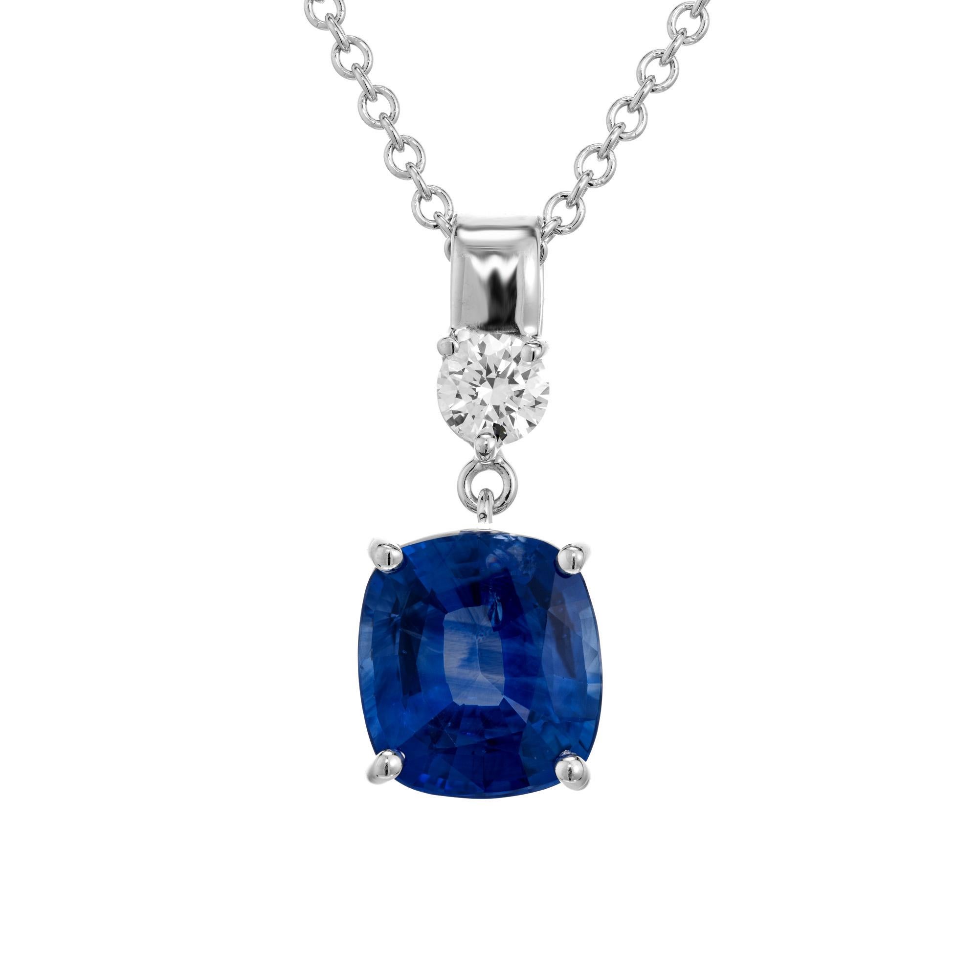 Sapphire and diamond pendant necklace. GIA certified cushion cut 1.95ct sapphire, set in a simple classic four prong 14k white gold setting with one round brilliant cut accent diamond. 16 inch 14k white gold link chain. GIA has certified this
