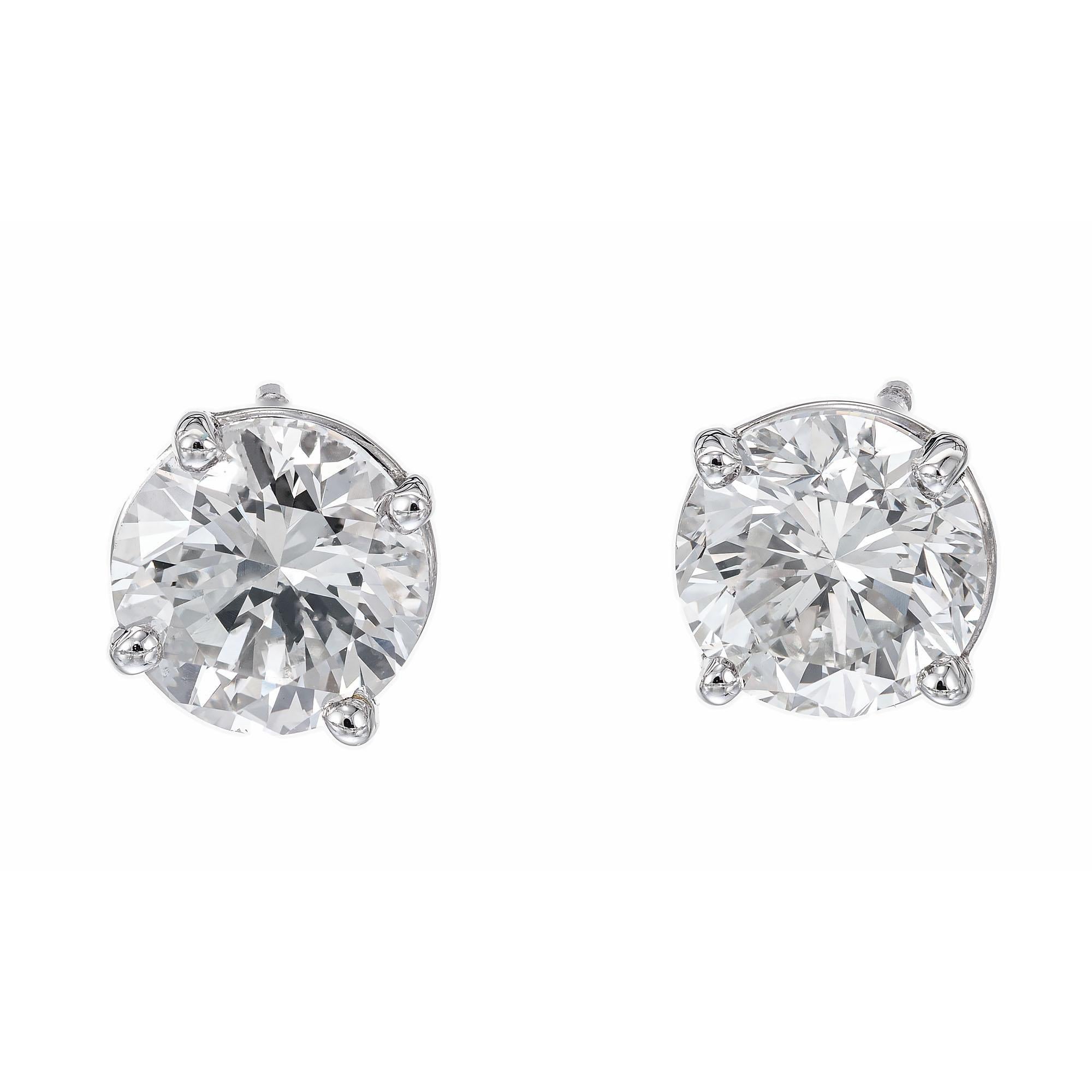 Diamond stud earrings. GIA Certified European transitional cut diamonds mounted in platinum baskets. Designed and crafted in the Peter Suchy workshop.

1 round brilliant cut diamond, J SI2 approx. 1.00ct GIA Certificate # 5181038115
1 round