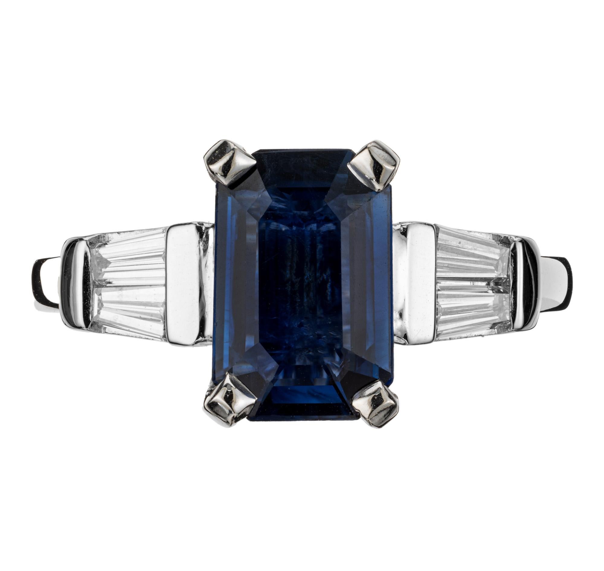 Sapphire and diamond engagement ring. Deep rich blue octagonal 2.09ct sapphire center stone, mounted in a platinum three-stone setting with two tapered baguettes on each side. The GIA has certified its as natural, no heat. Designed and crafted in