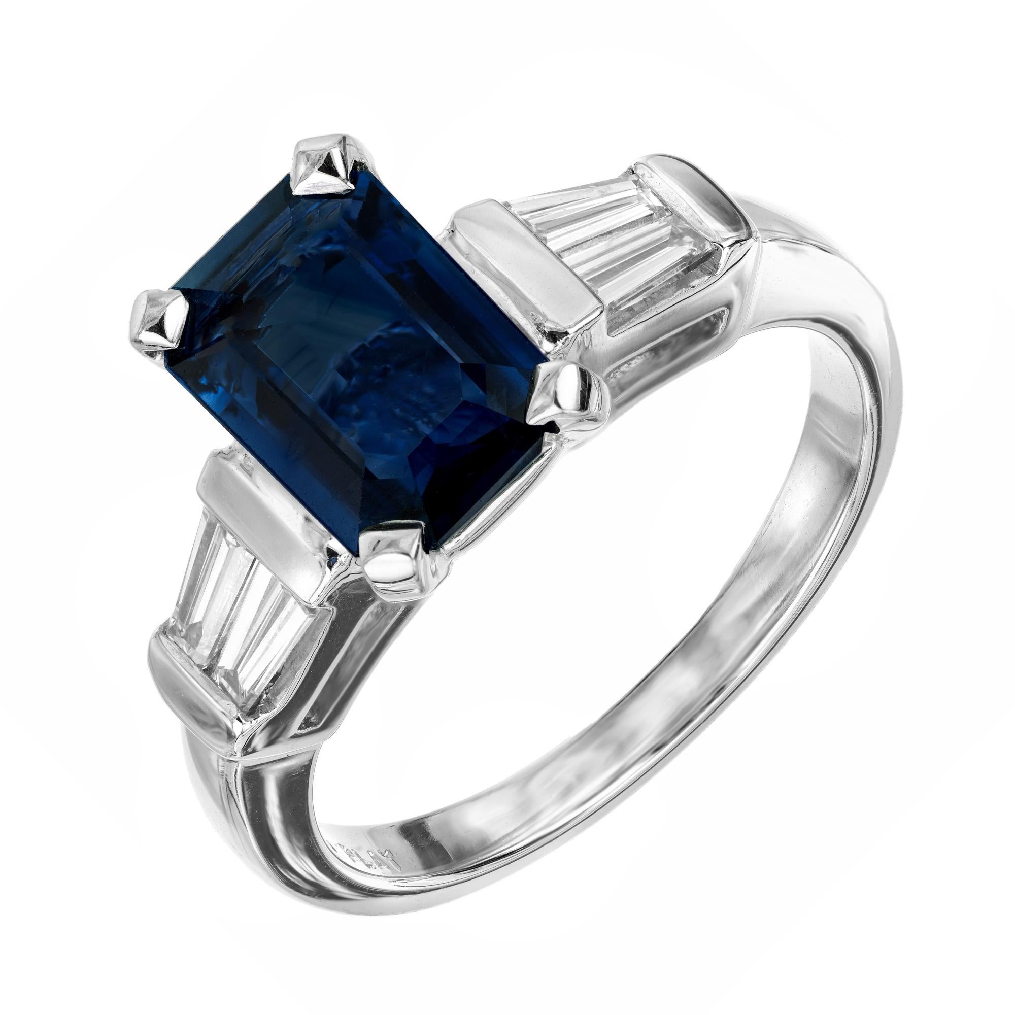 Art Deco Inspired sapphire and diamond engagement ring. The center of this mounting is set with a 2.09 octagonal step cut blue sapphire which is accented by two tapered baguette diamonds on each side of the stone. The sapphire is GIA certified as