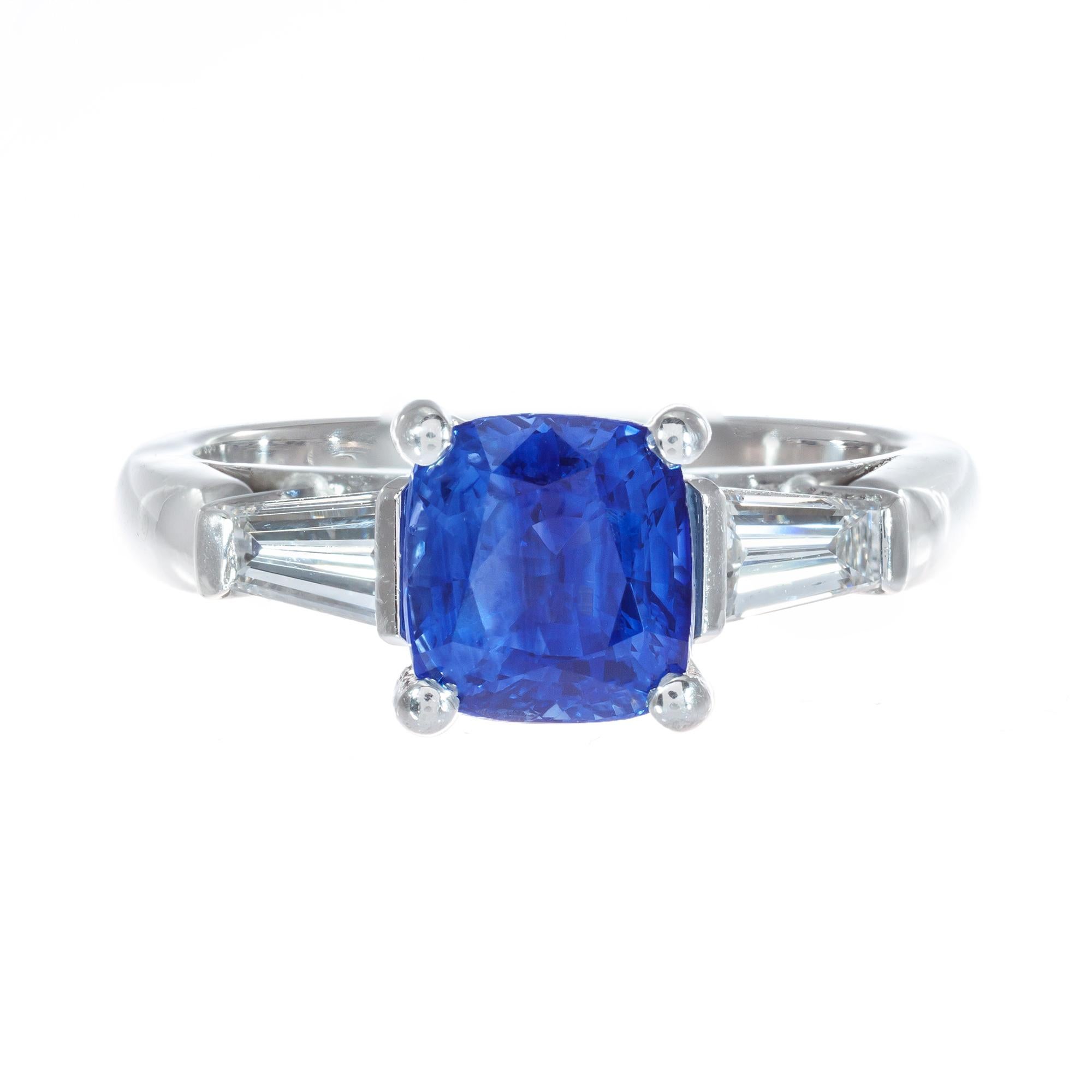 Peter Suchy blue cushion cut sapphire an diamond engagement ring. GIA certified natural cushion center sapphire simple heat only. No other enhancements. The sapphire is from an estate circa 1930 and set in a platinum three-stone setting with two