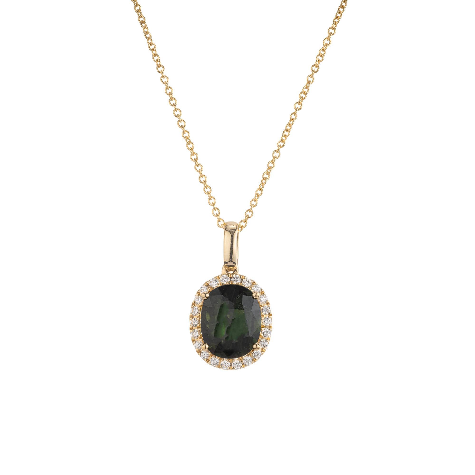GIA certified natural oval 2.17 carat unique bluish green sapphire and diamond pendant necklace. The center piece of the pendant is a 2.17ct oval green sapphire, mounted in 14k yellow gold setting with a halo of 22 round brilliant cut diamonds. The