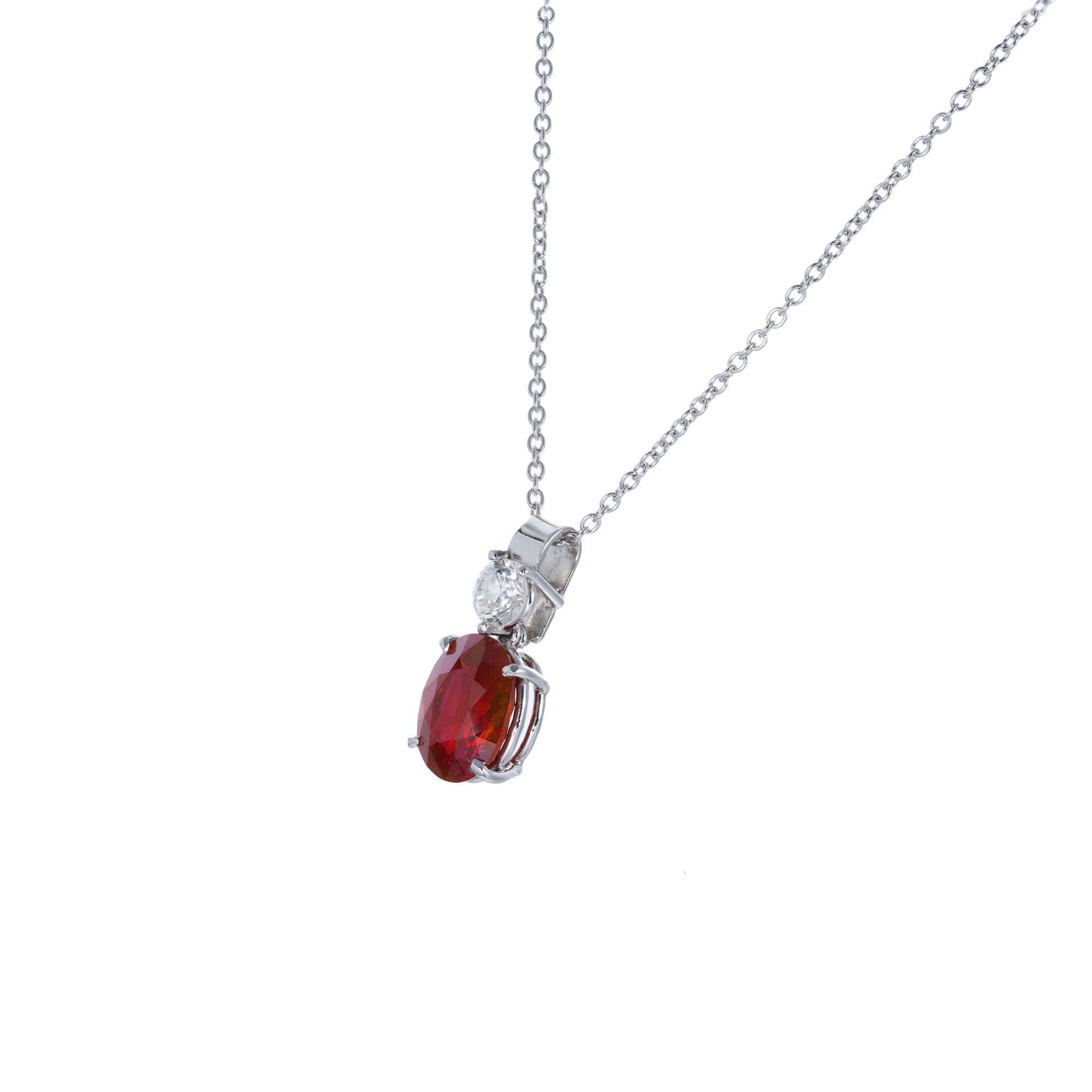 GIA Certified oval 2.21 carat ruby in a simple custom made platinum pendant setting with a round diamond accent. Created in the Peter Suchy Workshop.  

1 oval red ruby SI, approx. 2.21ct GIA Certificate #1196068191
1 round brilliant cut diamond I