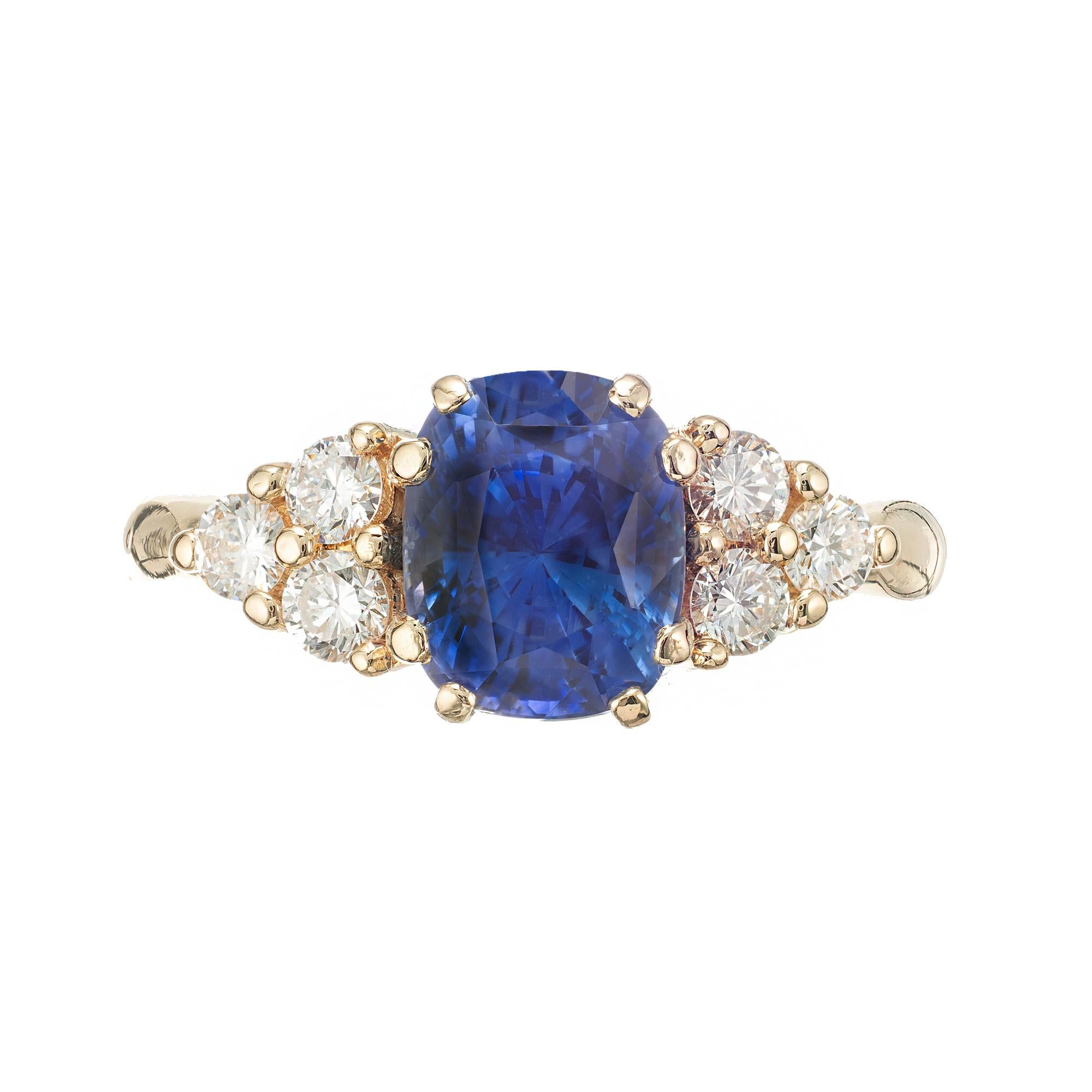 Cornflower blue oval sapphire and diamond engagement ring. GIA certified natural simple heat only, no residue. 14k yellow gold setting with 6 accent round diamonds on each side. Designed and crafted in the Peter Suchy Workshop. 

1 oval blue SI