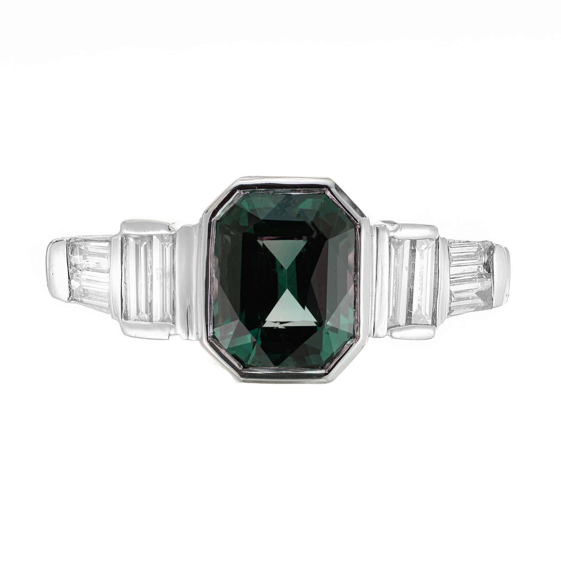 Octagonal Art Deco step emerald step cut sapphire and diamond engagement ring. GIA certified as natural no heat , no enhancements green blue center octagonal center 2.30ct sapphire with 8 baguette cut accent diamonds in a platinum setting. The