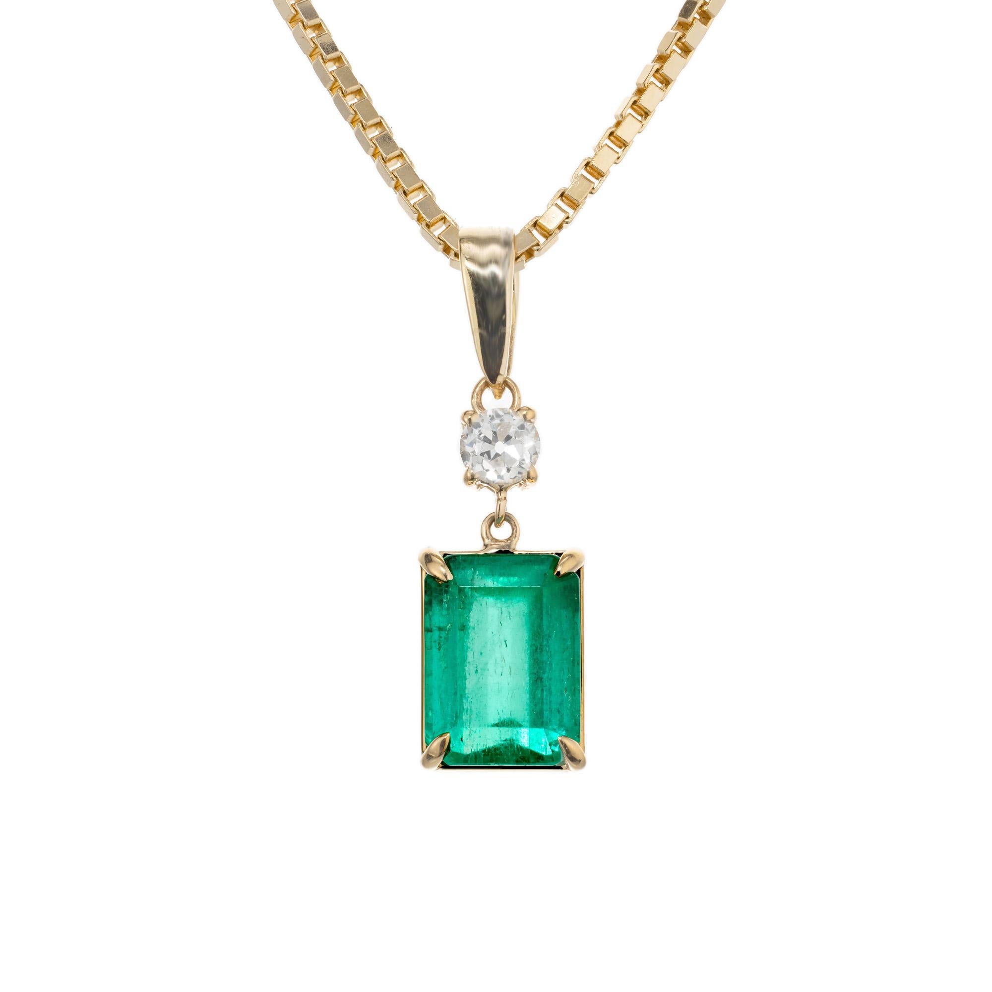 Natural emerald cut emerald and diamond pendant necklace. GIA certified 2.40ct octagonal step cut green emerald mounted into a 14k yellow gold setting with a round brilliant cut accent diamond. 16.50 14k yellow gold chain. The GIA certified this as