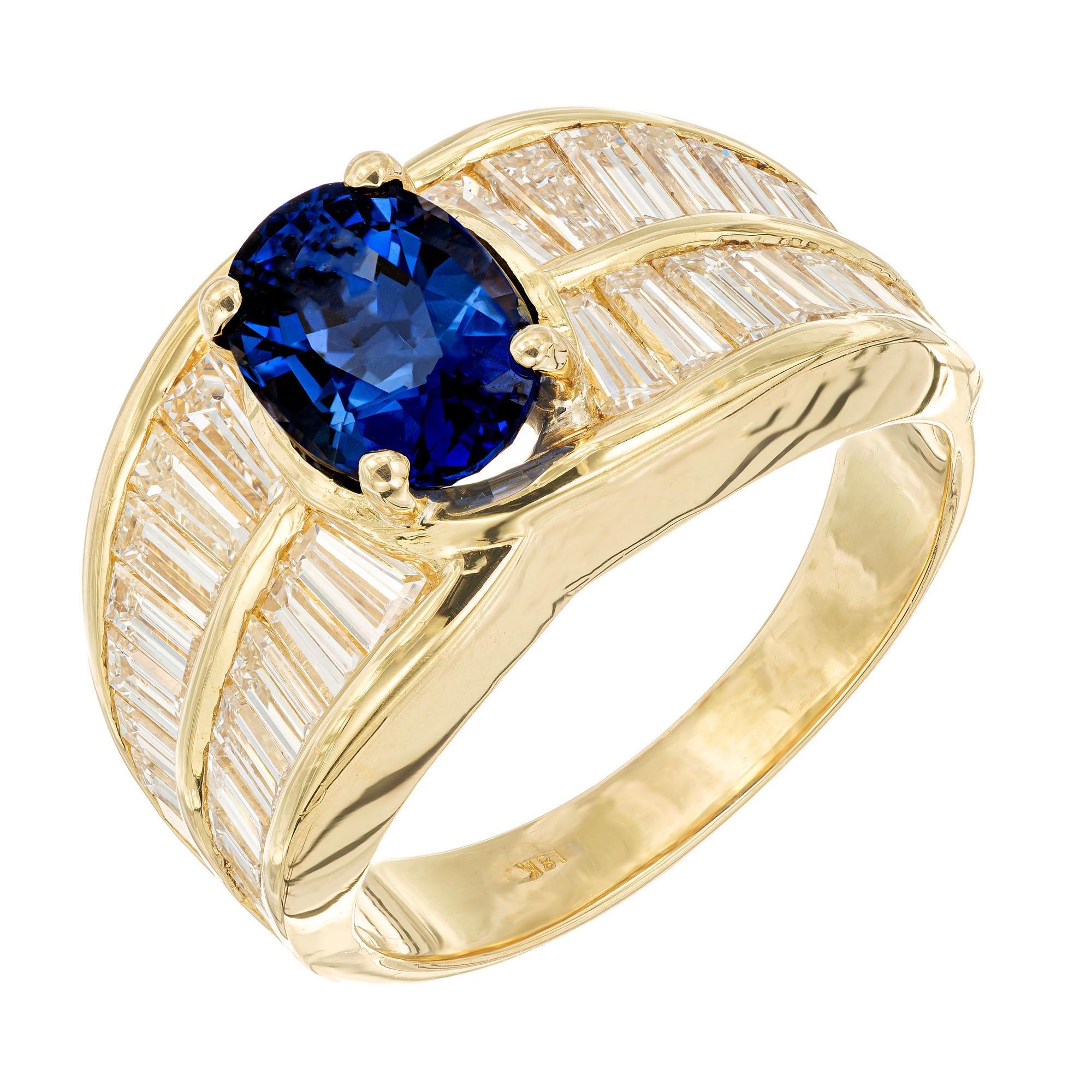 1940's Sapphire and diamond cocktail ring. GIA certified oval sapphire center stone accented with 32 straight and tapered baguette diamonds in a 18k yellow gold setting. GIA certified as natural, no heat or enhancements. Designed and crafted in the