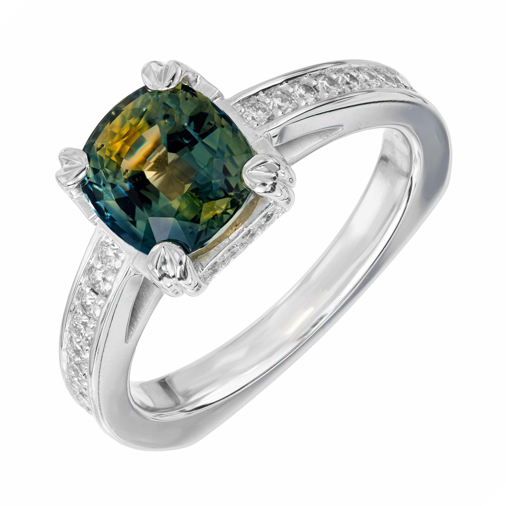 A mesmerizing natural teal color untreated GIA certified 2.72 carat cushion sapphire in a custom-designed 14k white gold ring. Accented with 40 round diamonds of approximately .65 carats set in the shank and gallery. This dazzling ring is one like