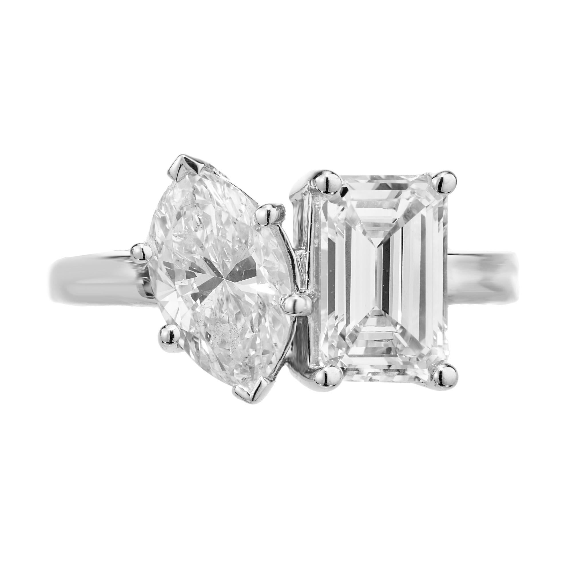 Beautifully made Toi et Moi platinum diamond ring featuring a 1.51 carat Art Deco emerald cut diamond paired with a well matched 1.31 carat marquise stone. The emerald cut diamond is graded by the GIA as near colorless, as is the marquise cut