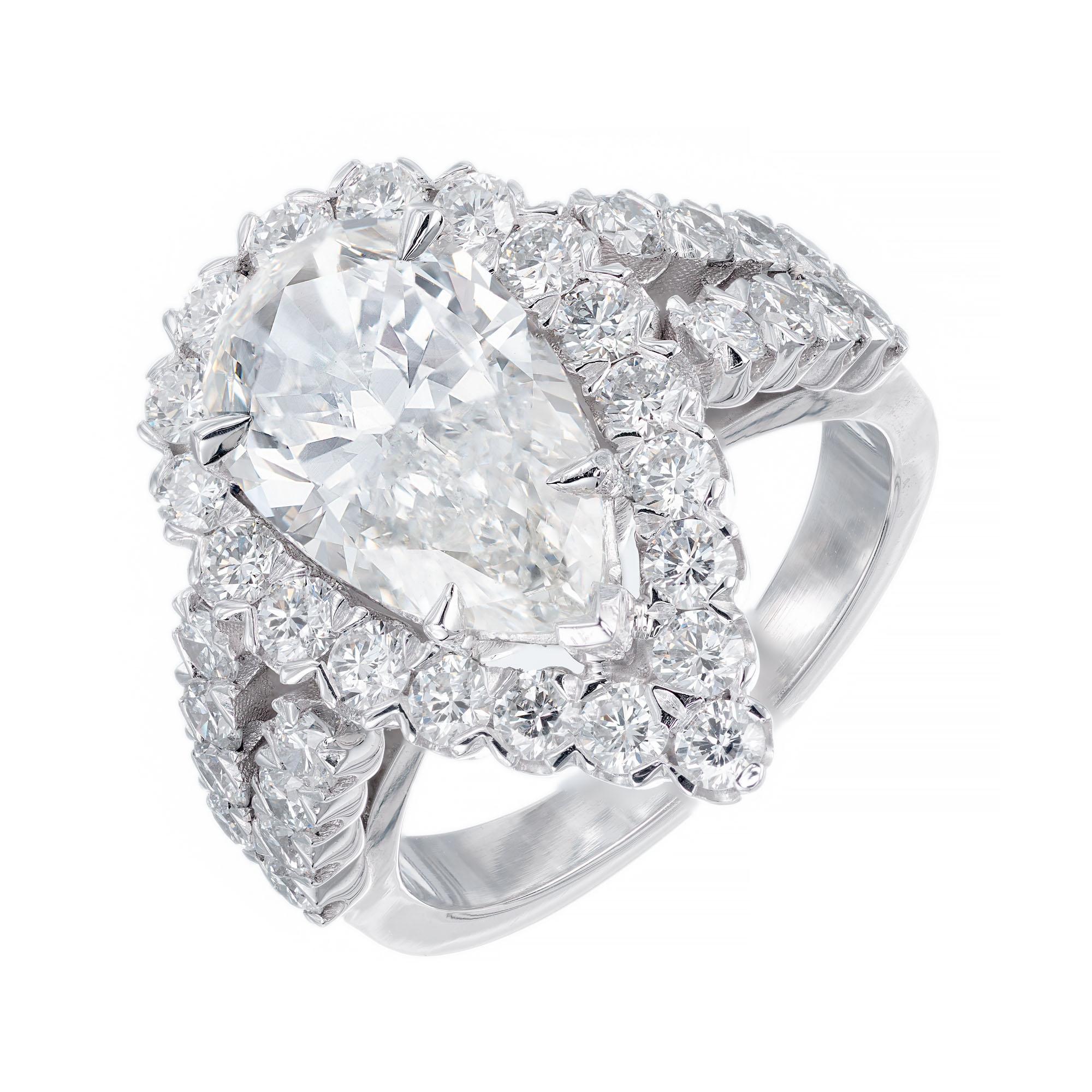 Peter Suchy custom design 2.96 carat pear shape diamond. Bright sparkle, cut for brilliance and size. The center stone is GIA certified with a halo of 35 round brilliant cut diamonds in a split shank platinum setting created in the Peter Suchy
