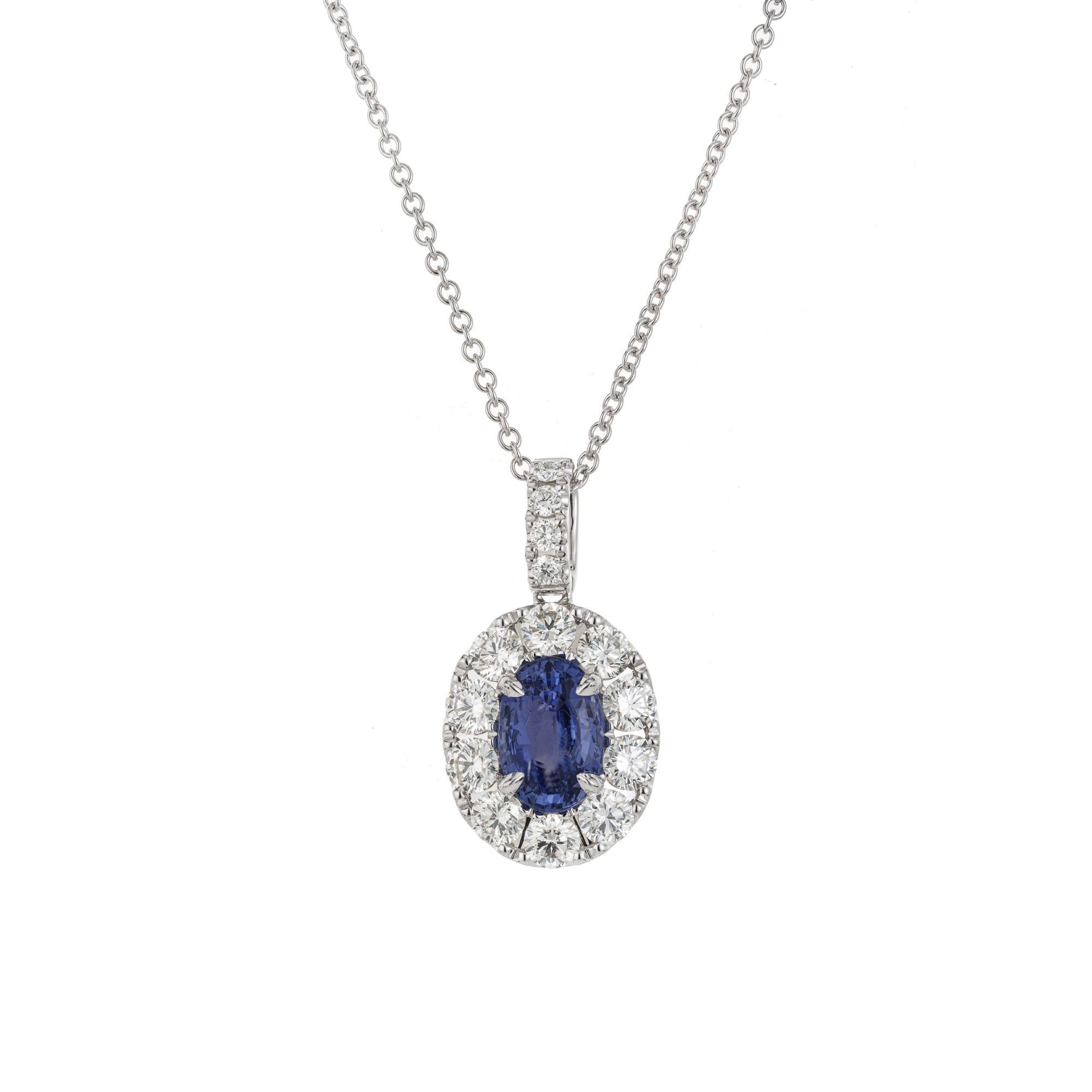 Beautiful sapphire and diamond pedant necklace. FGL Certified 3.04 carat oval blue natural no heat sapphire mounted in an 18k white gold setting with a halo of round brilliant cut diamonds, accented with diamonds along the bail with a total carat