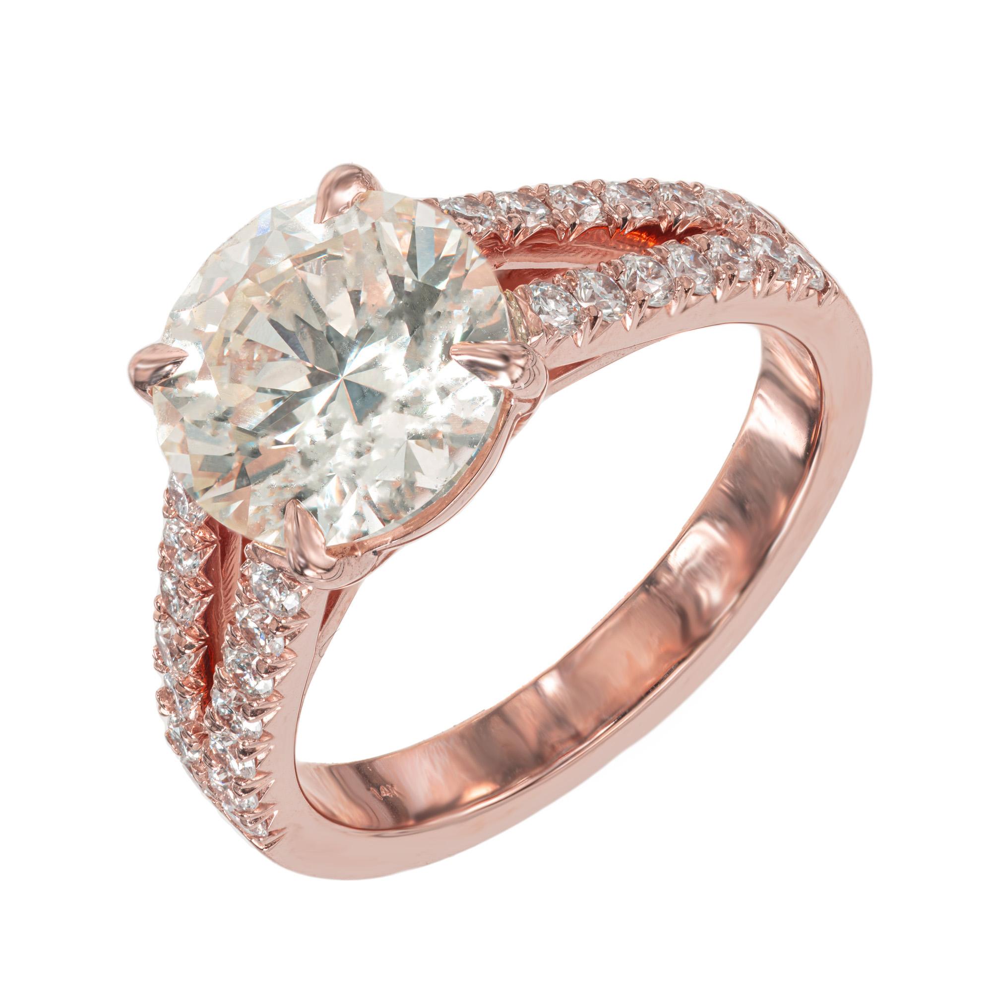 Spectacular diamond split shank 14k rose gold engagement ring. The center stone is a beautiful 3.08ct round brilliant cut diamond mounted in a split shank setting that is adorned with 28 round brilliant cut diamonds along both shoulders and of the