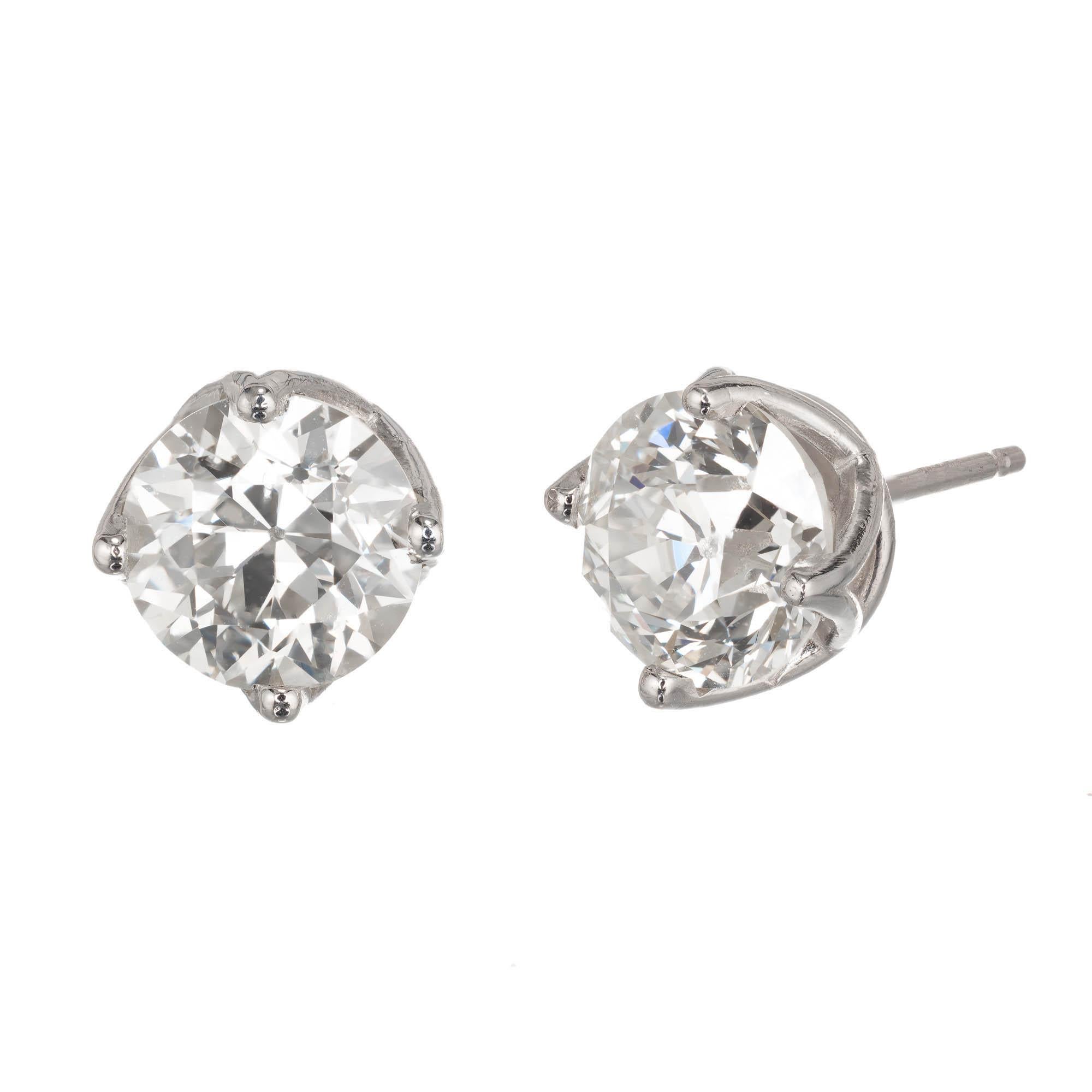 Old European cut diamond stud earrings.  2 old European diamonds in platinum curved prong baskets. Crafted in the Peter Suchy Jewelers Workshop. 

1 old European cut M SI diamond, Approximate 1.59 carats. Gia Certificate # 2781819383
1 old European