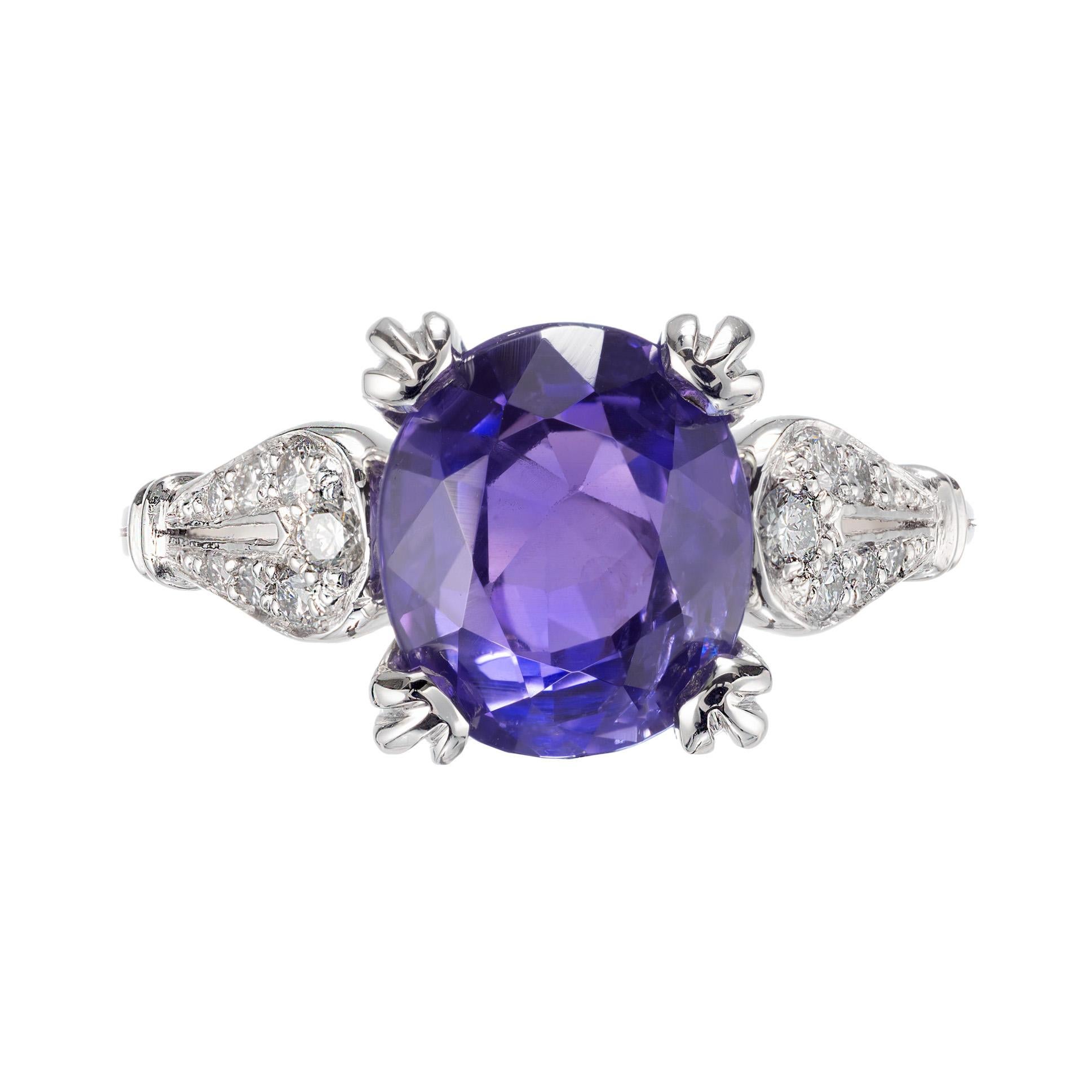 Oval violet blue sapphire and diamond engagement ring. GIA certified no heat color change center sapphire in a platinum setting with 14 round brilliant cut accent diamonds. Color changes from violet to blue when viewed under daylight or fluorescent