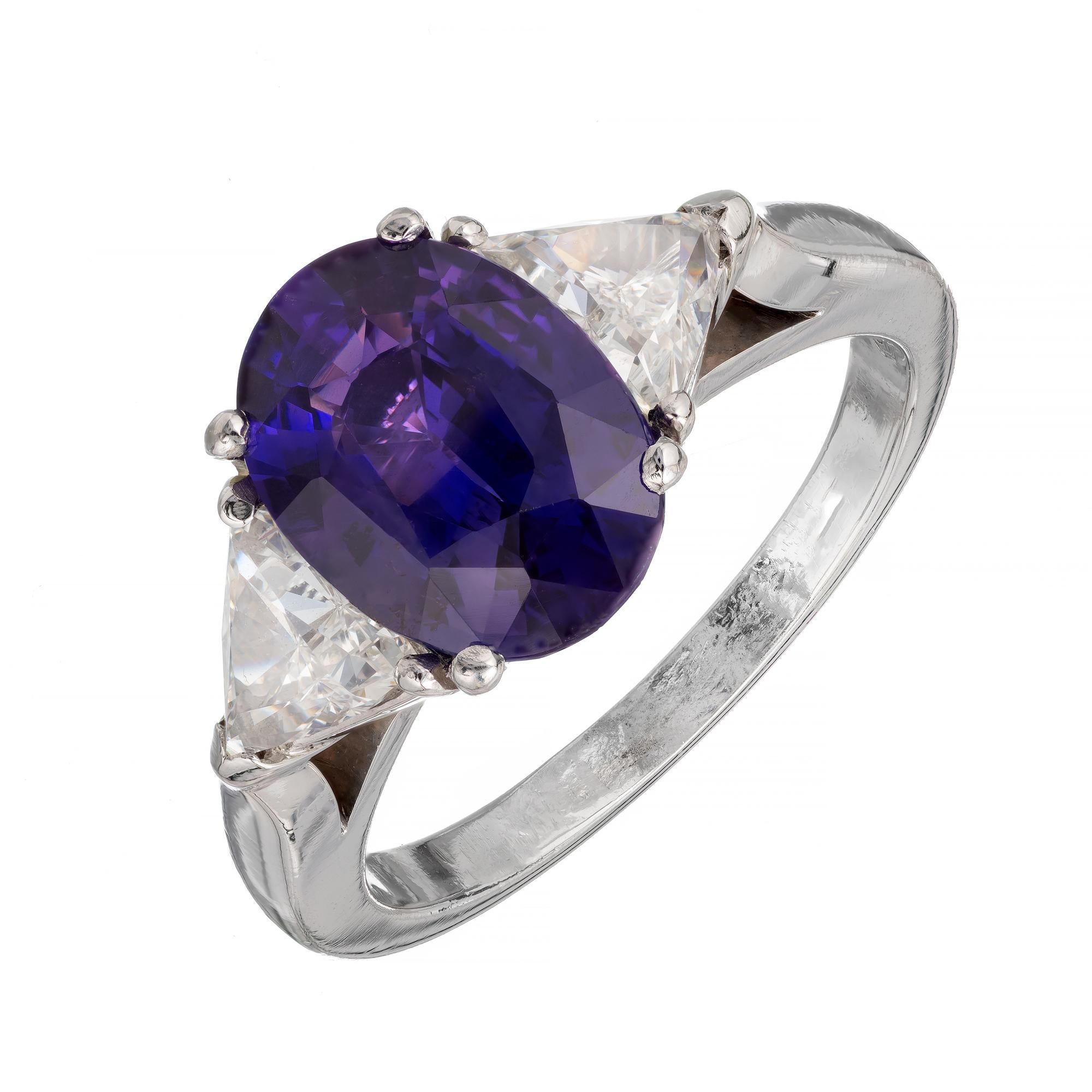 Oval natural untreated color change sapphire and diamond ring. Changes from blush violet to purple depending on light. GIA certified natural no heat, oval center sapphire with two accent trilliant cut side diamonds in a three-stone setting made in