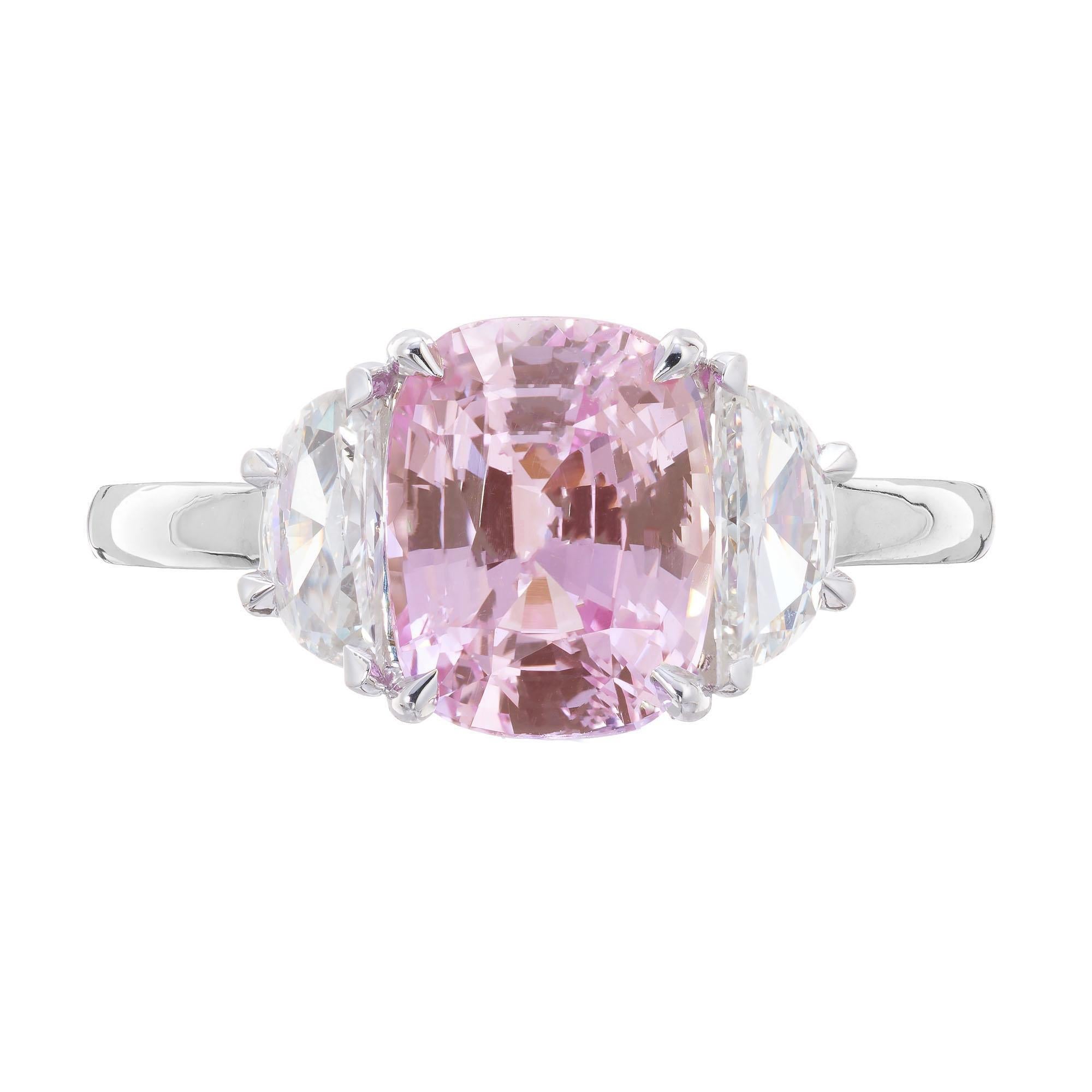 Sapphire and diamond engagement ring. GIA certified 3.50 Carat natural cushion cut pink sapphire in a platinum three-stone setting with 2 halfmoon side diamonds. The pink sapphire is from a 1920's estate. Designed and crafted in the Peter Suchy