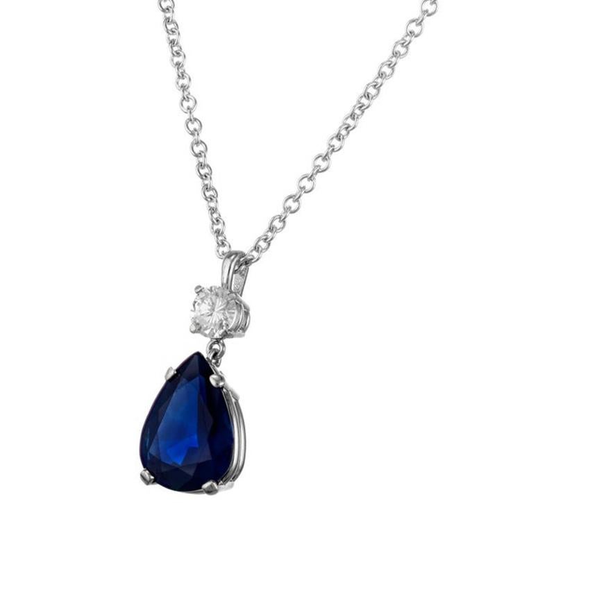 Deep blue pear shaped 3.59 carat sapphire an diamond pendant necklace. GIA certified natural pear shaped sapphire, simple heat only in a dangle pendant with a round shaped diamond above. 14k white gold setting with a 14k white gold 16.5 inch chain.