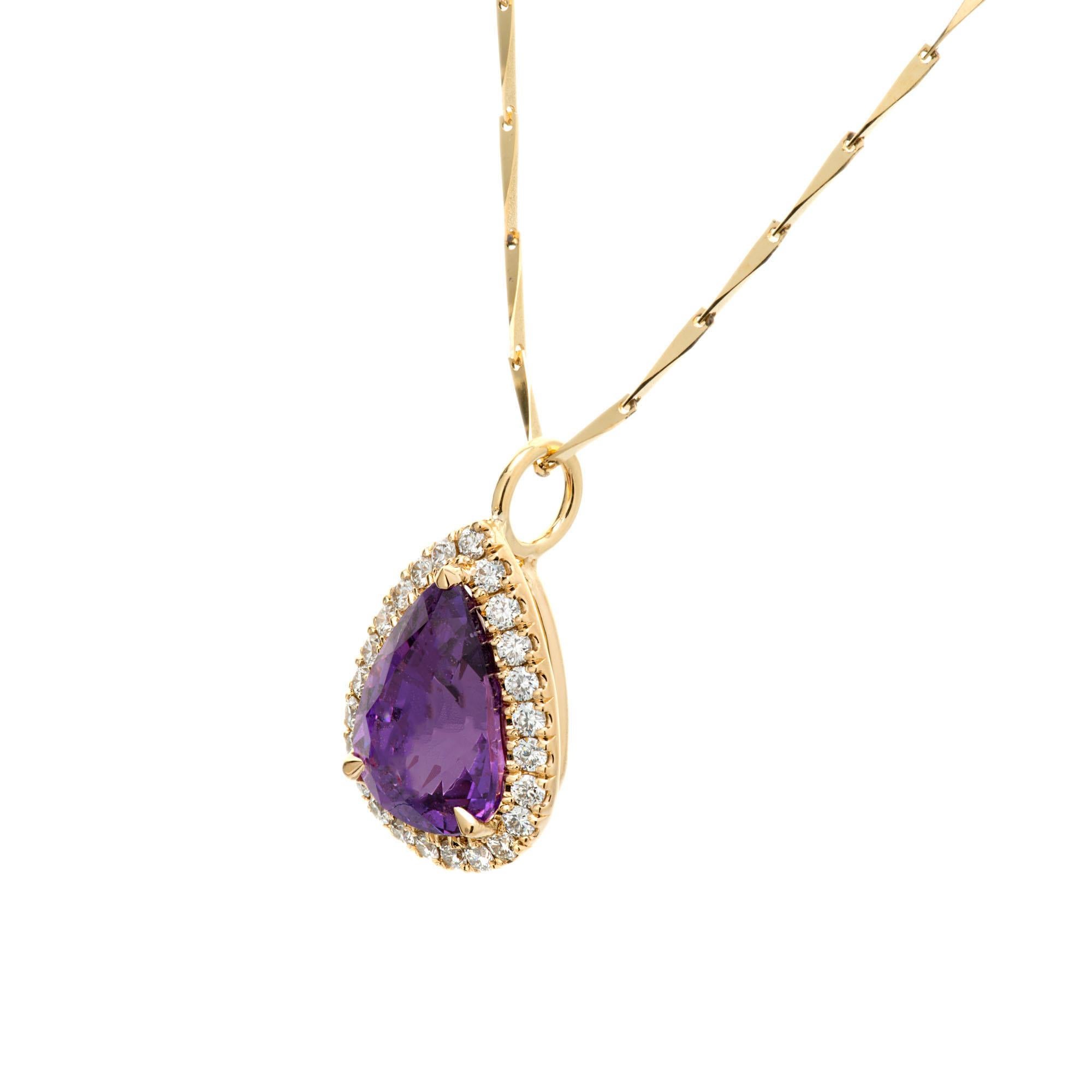 Purple natural untreated sapphire diamond pendant necklace. Pear shaped purple sapphire with a halo of 24 round brilliant cut diamonds set in 18k yellow gold. 15.75 inch chain. Designed and crafted in the Peter Suchy workshop.

1 pear shaped purple