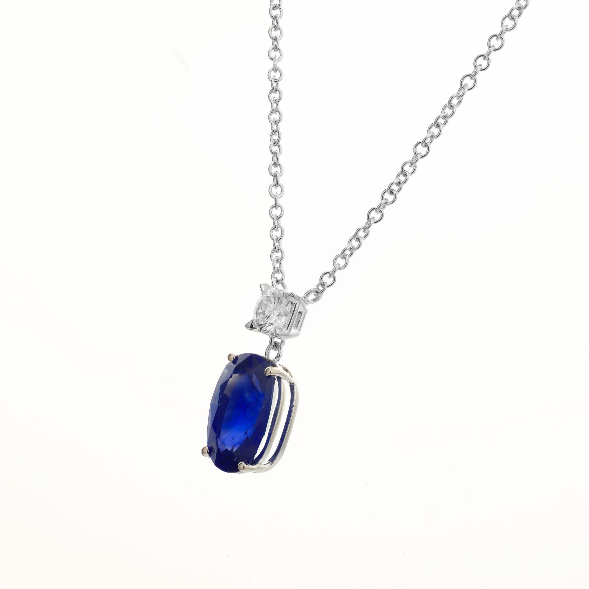 Oval sapphire and diamond pendant necklace. GIA certified 3.82 carat oval sapphire, natural with simple heat only. Fine blue with some natural color zoning towards the top of the stone accented with a round brilliant cut diamond set in 18k white