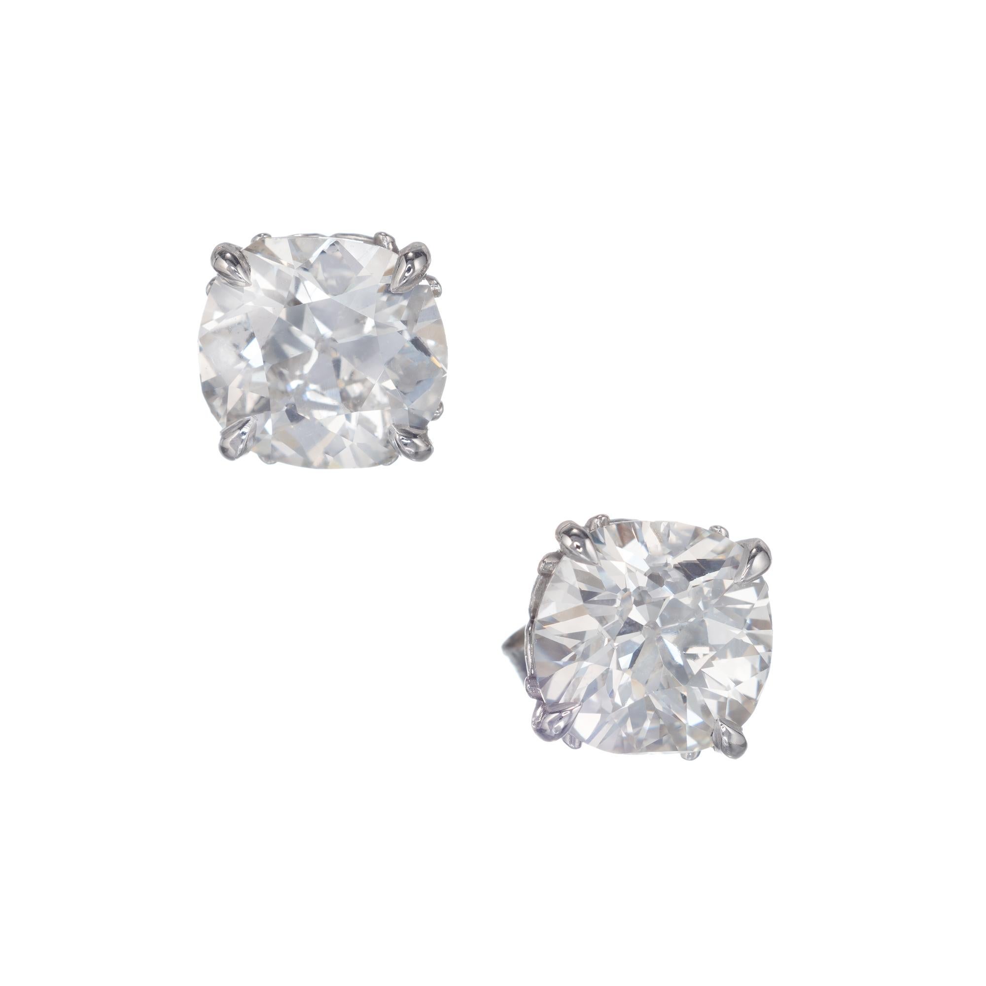 4.29 Cushion brilliant cut diamond stud earrings. Set in two open work platinum scroll baskets from the Peter Suchy workshop 

1 cushion brilliant cut J I diamond, Approximate 2.21cts GIA Certificate # 2175678317
1 cushion brilliant cut II diamond,