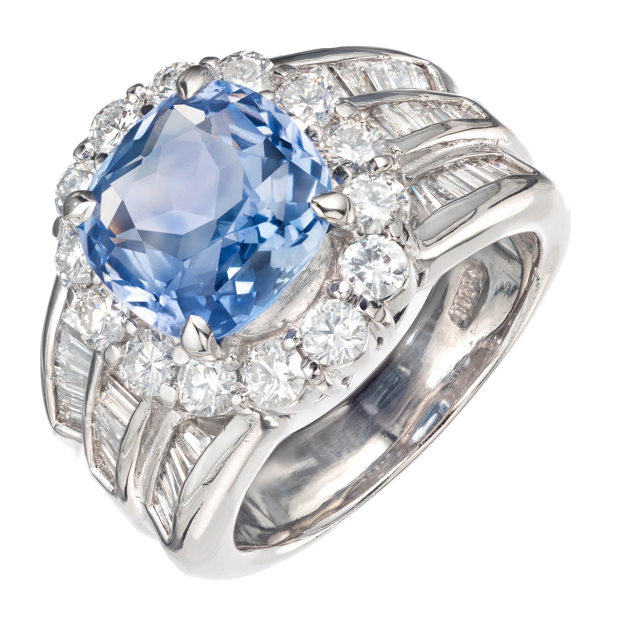 Sapphire and diamond engagement ring. Cushion cut natural untreated light blue periwinkle sapphire set in a diamond halo platinum setting with baguette accent side diamonds. GIA certifed. Made in the Peter Suchy  Workshop. 

1 cushion brilliant cut