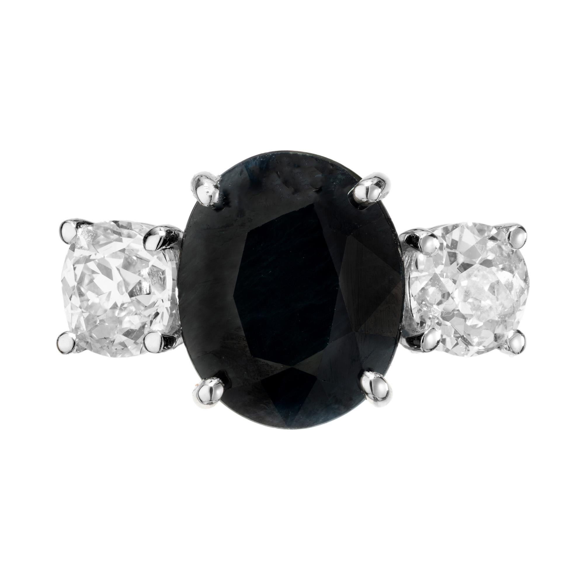Introducing the Peter Suchy GIA Certified 5.00ct Sapphire and Diamond Platinum engagement ring. This stunning piece is meticulously crafted to perfection, featuring a vibrant 5.00 carat rich, dark blue oval sapphire, which is mounted into a paltinum