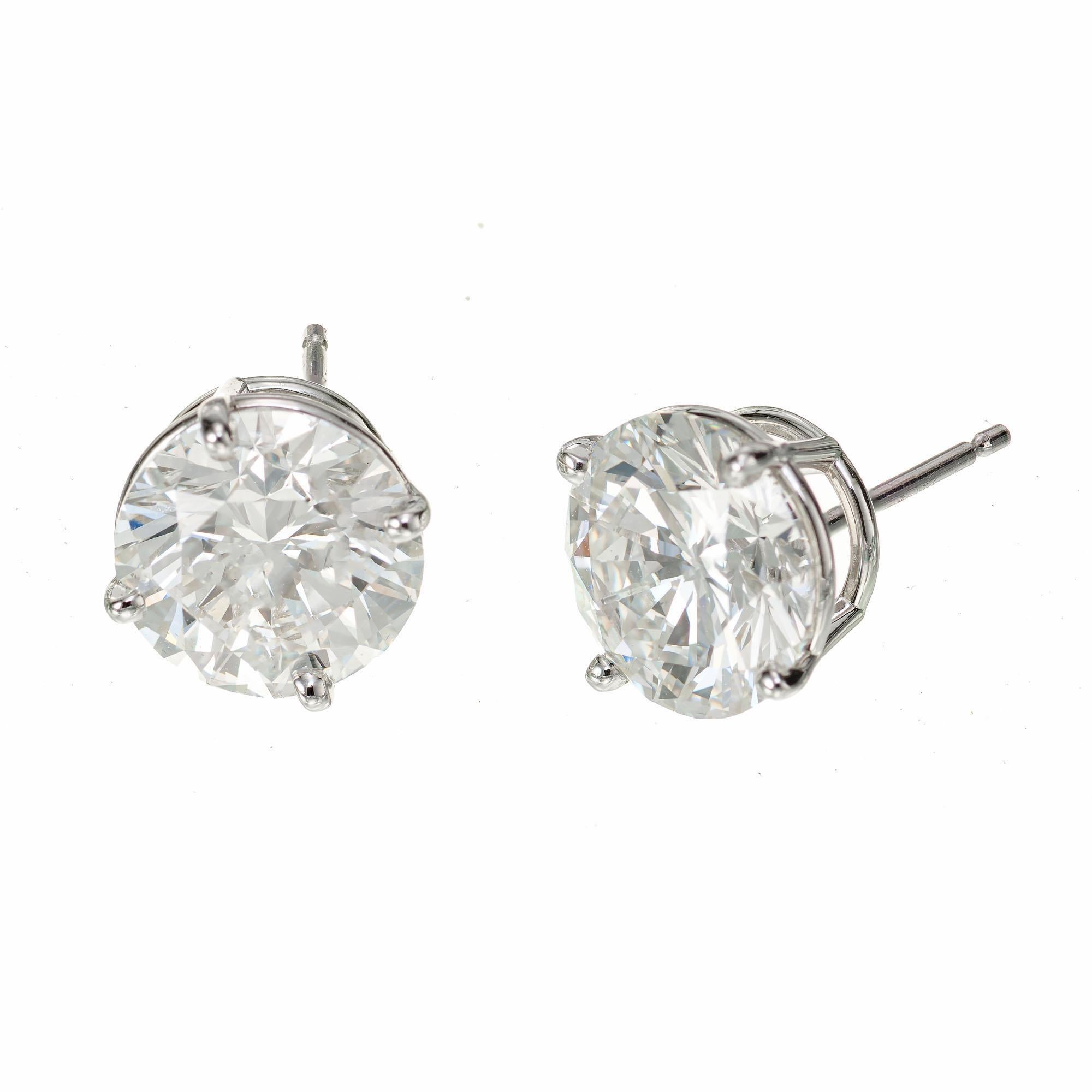 Diamond stud earrings. 2 round brilliant cut diamonds totaling 5.03cts, in platinum basket settings. Well matched and cut. Both diamonds are GIA certified. Designed and crafted in the Peter Suchy workshop.

1 round brilliant cut diamond, I SI