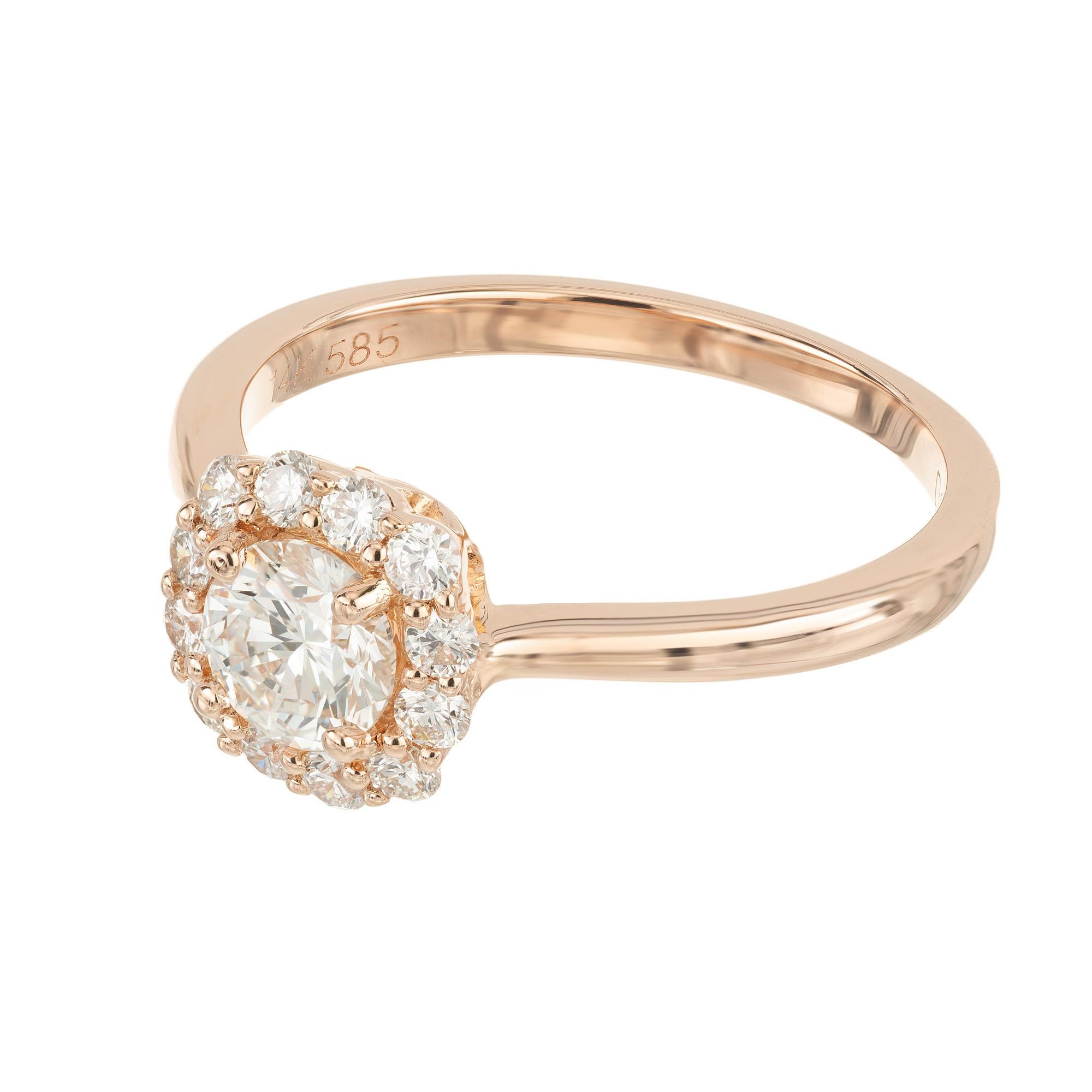Indulge in the romantic allure of the Peter Suchy GIA certified .51ct diamond halo rose gold engagement ring. This exquisite piece is a true celebration of timeless elegance, where the .51 carat diamond takes center stage, its brilliance is