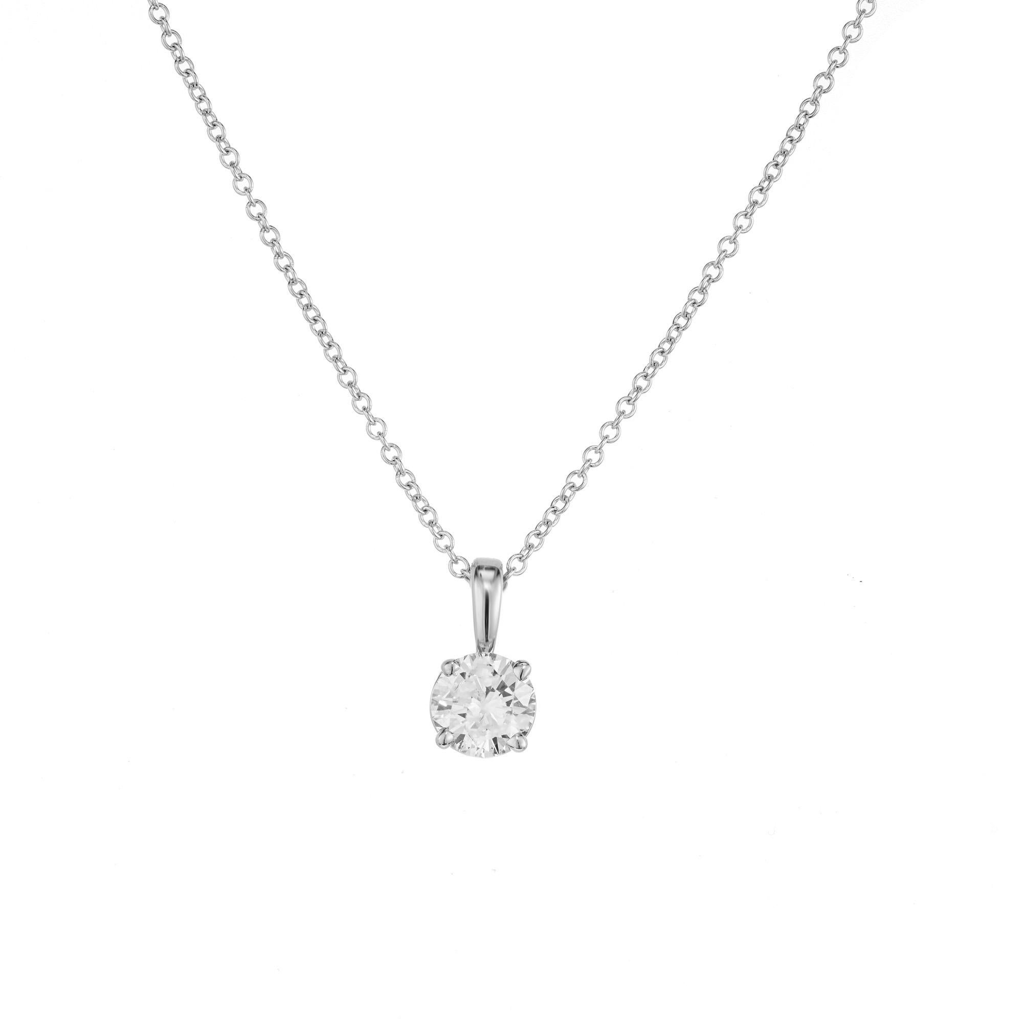 A classic timeless solitaire GIA certified round brilliant cut .54 carat diamond in a 14k white gold setting with a 14k white gold 16” chain. This is a bright, sparkly, and brilliant stone that one could never go wrong with wearing for any occasion