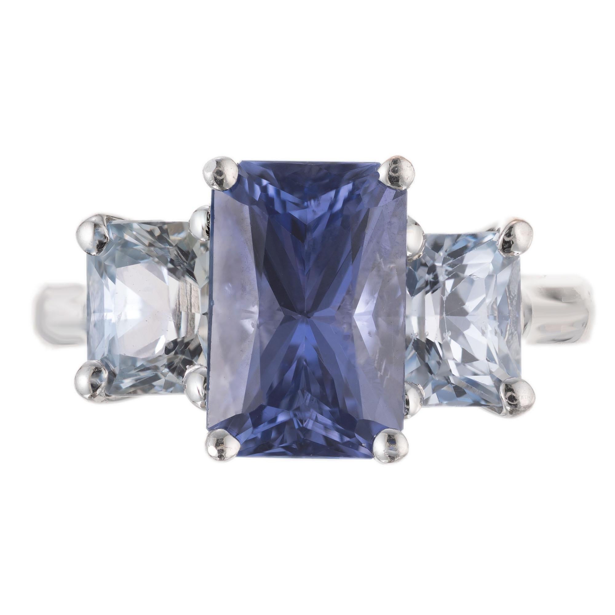 Sapphire Three-stone engagement ring. GIA certified 3.47cts octagonal center sapphire, mounted in a platinum three-stone setting, accented with a light blue octagonal sapphire on each side of the stone. All three stones are GIA certified. This is a